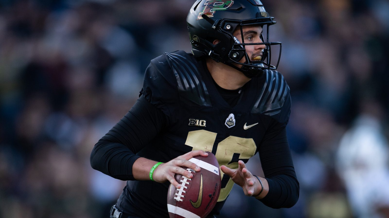 Purdue Boilermakers quarterback Aidan O'Connell (16) scrambles to the sidelines during the college football game between the Purdue Boilermakers and Michigan State Spartans on November 6, 2021, at Ross-Ade Stadium in West Lafayette, IN.