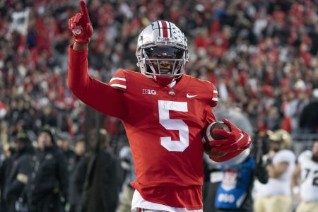 Ohio State Buckeyes wide receiver Garrett Wilson #5 celebrating as he runs with the ball during the game between the Ohio State Buckeyes and the Purdue Boilermakers at Ohio Stadium in Columbus, Ohio on November 13, 2021.