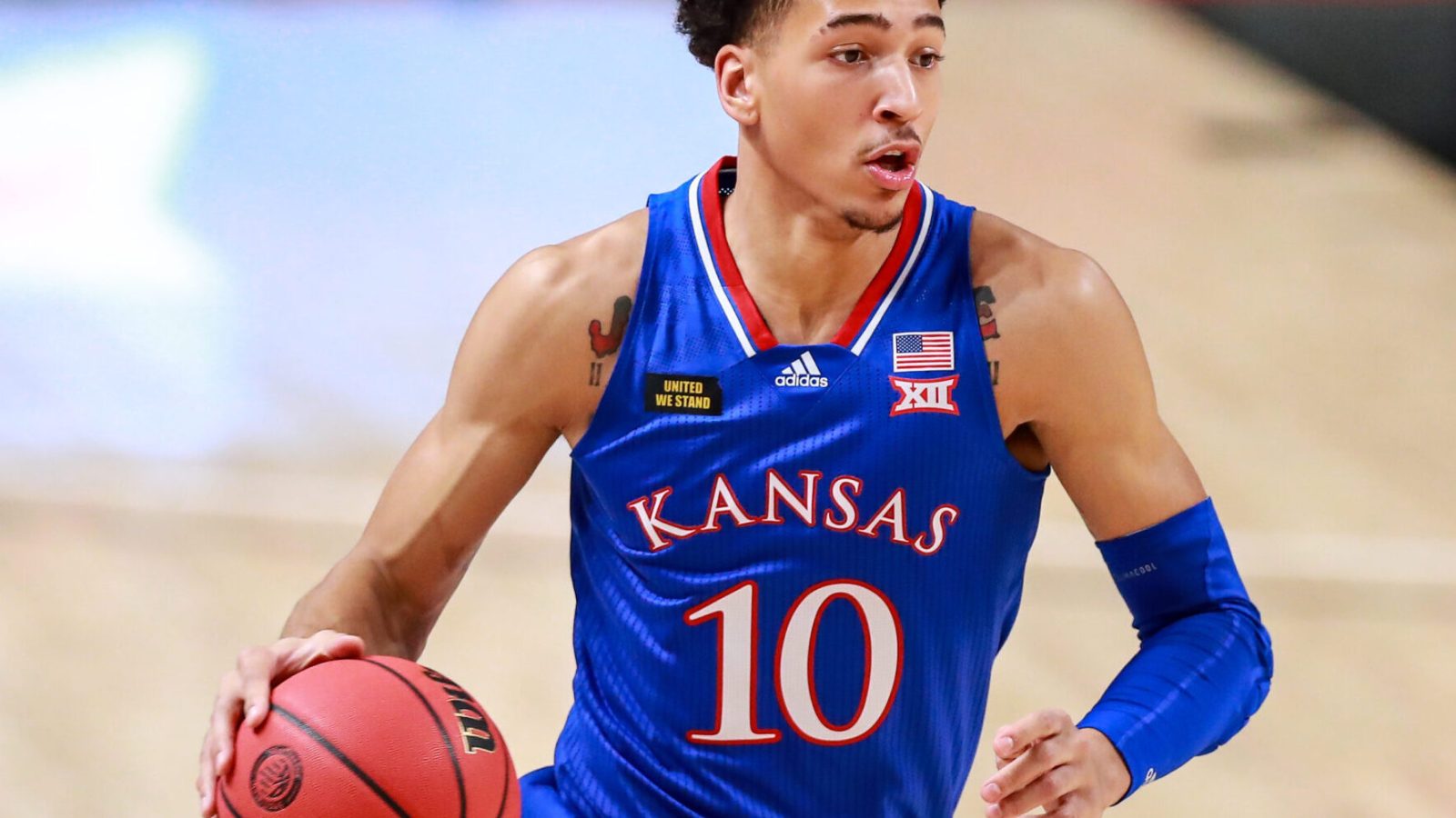 Forward Jalen Wilson #10 of the Kansas Jayhawks handles the ball during the first half of the college basketball game against the Texas Tech Red Raiders at United Supermarkets Arena on December 17, 2020 in Lubbock, Texas.