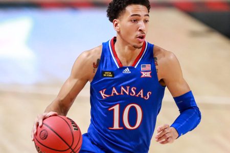Forward Jalen Wilson #10 of the Kansas Jayhawks handles the ball during the first half of the college basketball game against the Texas Tech Red Raiders at United Supermarkets Arena on December 17, 2020 in Lubbock, Texas.