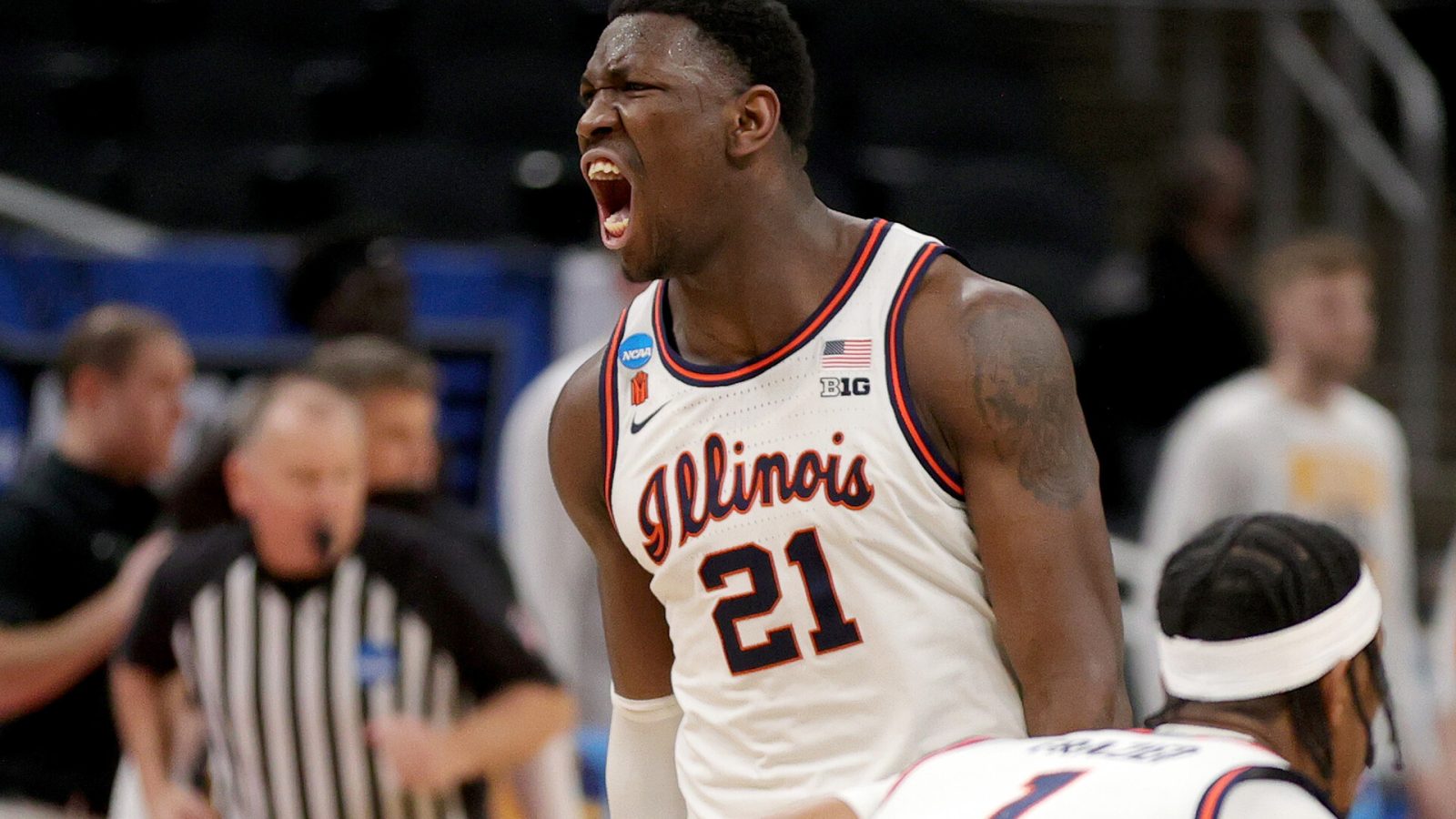 Kofi Cockburn #21 of the Illinois Fighting Illini reacts to a basket against the Loyola Chicago Ramblers during the first half in the second round game of the 2021 NCAA Men's Basketball Tournament at Bankers Life Fieldhouse on March 21, 2021 in Indianapolis, Indiana.