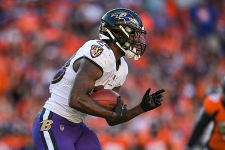Latavius Murray #28 of the Baltimore Ravens rushes against the Denver Broncos in the third quarter of a game at Empower Field at Mile High on October 3, 2021 in Denver, Colorado.