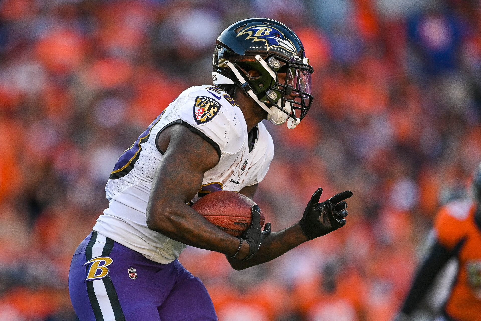 Latavius Murray #28 of the Baltimore Ravens rushes against the Denver Broncos in the third quarter of a game at Empower Field at Mile High on October 3, 2021 in Denver, Colorado.