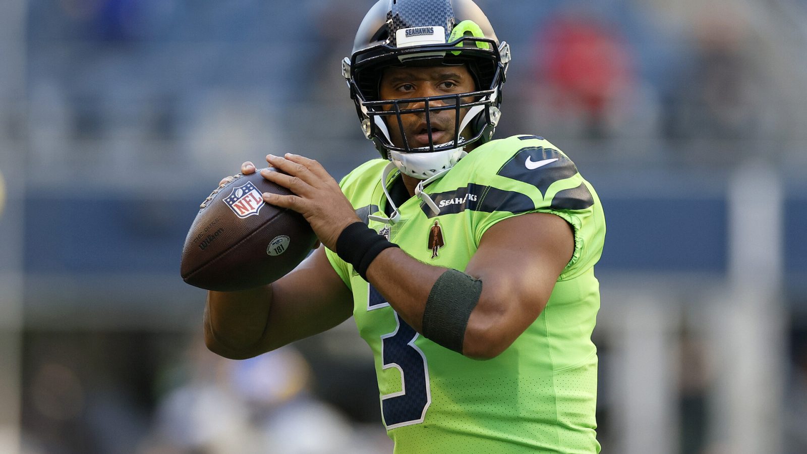 Russell Wilson #3 of the Seattle Seahawks warms up before the game against the Los Angeles Rams at Lumen Field on October 07, 2021 in Seattle, Washington.
