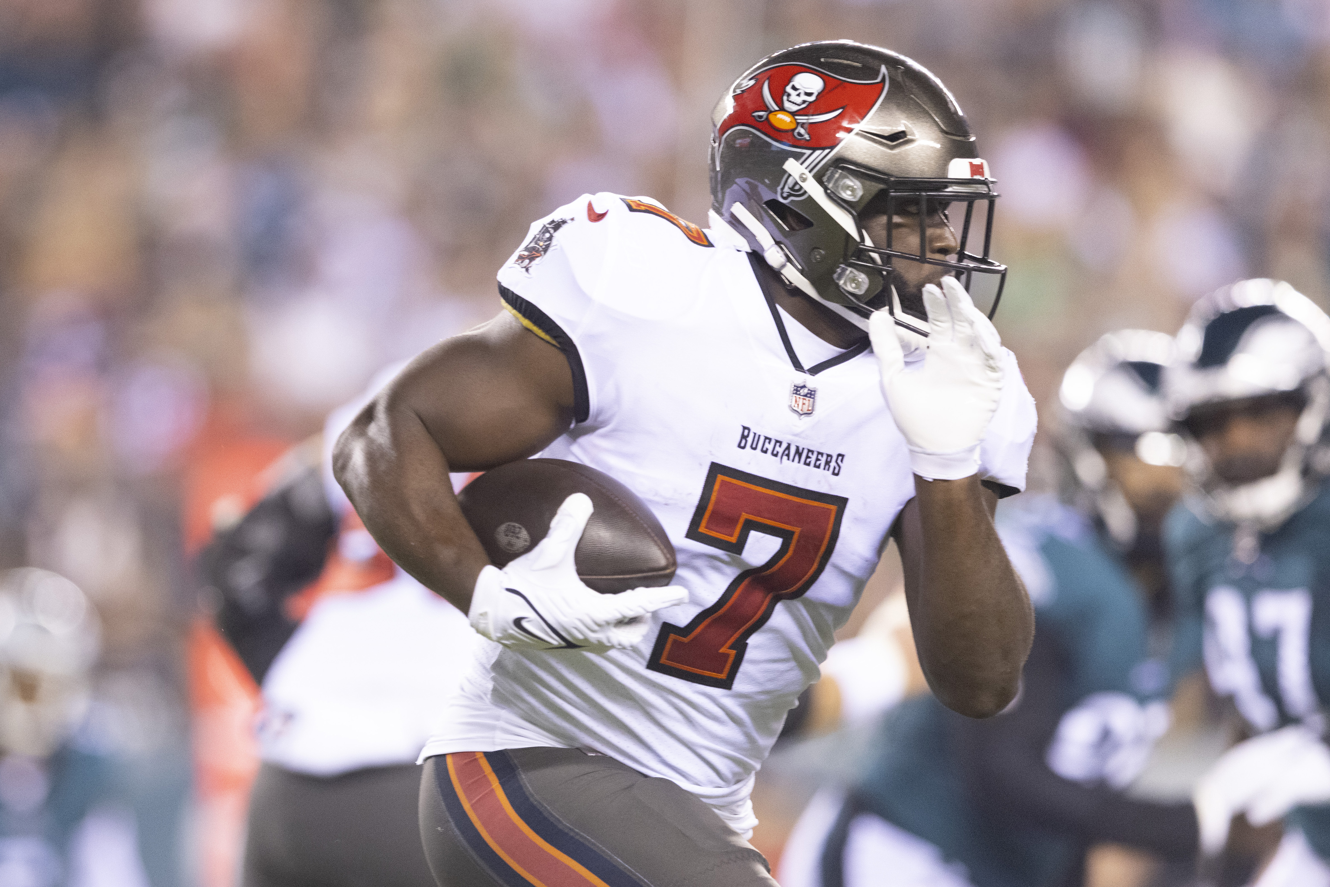 Leonard Fournette #7 of the Tampa Bay Buccaneers runs the ball against the Philadelphia Eagles at Lincoln Financial Field on October 14, 2021 in Philadelphia, Pennsylvania.