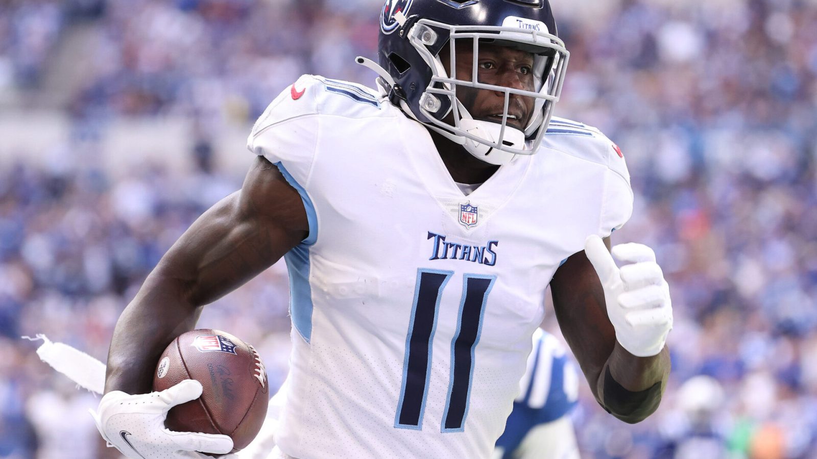 A.J. Brown #11 of the Tennessee Titans runs for a touchdown against the Indianapolis Colts at Lucas Oil Stadium on October 31, 2021 in Indianapolis, Indiana