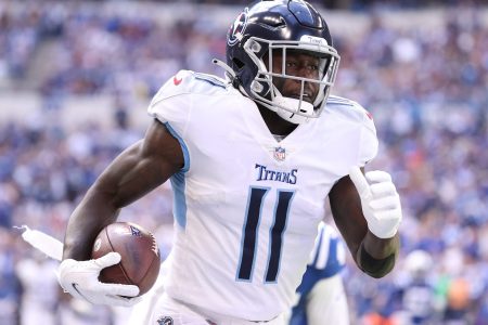 A.J. Brown #11 of the Tennessee Titans runs for a touchdown against the Indianapolis Colts at Lucas Oil Stadium on October 31, 2021 in Indianapolis, Indiana