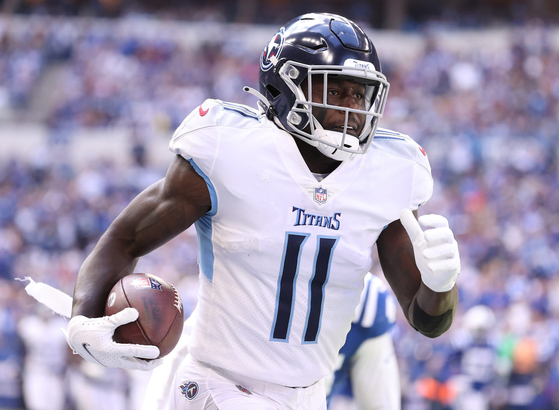 A.J. Brown #11 of the Tennessee Titans runs for a touchdown against the Indianapolis Colts at Lucas Oil Stadium on October 31, 2021 in Indianapolis, Indiana
