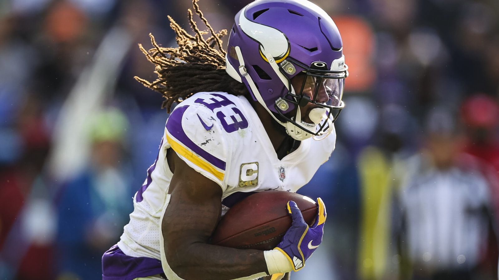 Dalvin Cook #33 of the Minnesota Vikings carries the ball against the Baltimore Ravens during the first half at M&T Bank Stadium on November 7, 2021 in Baltimore, Maryland.