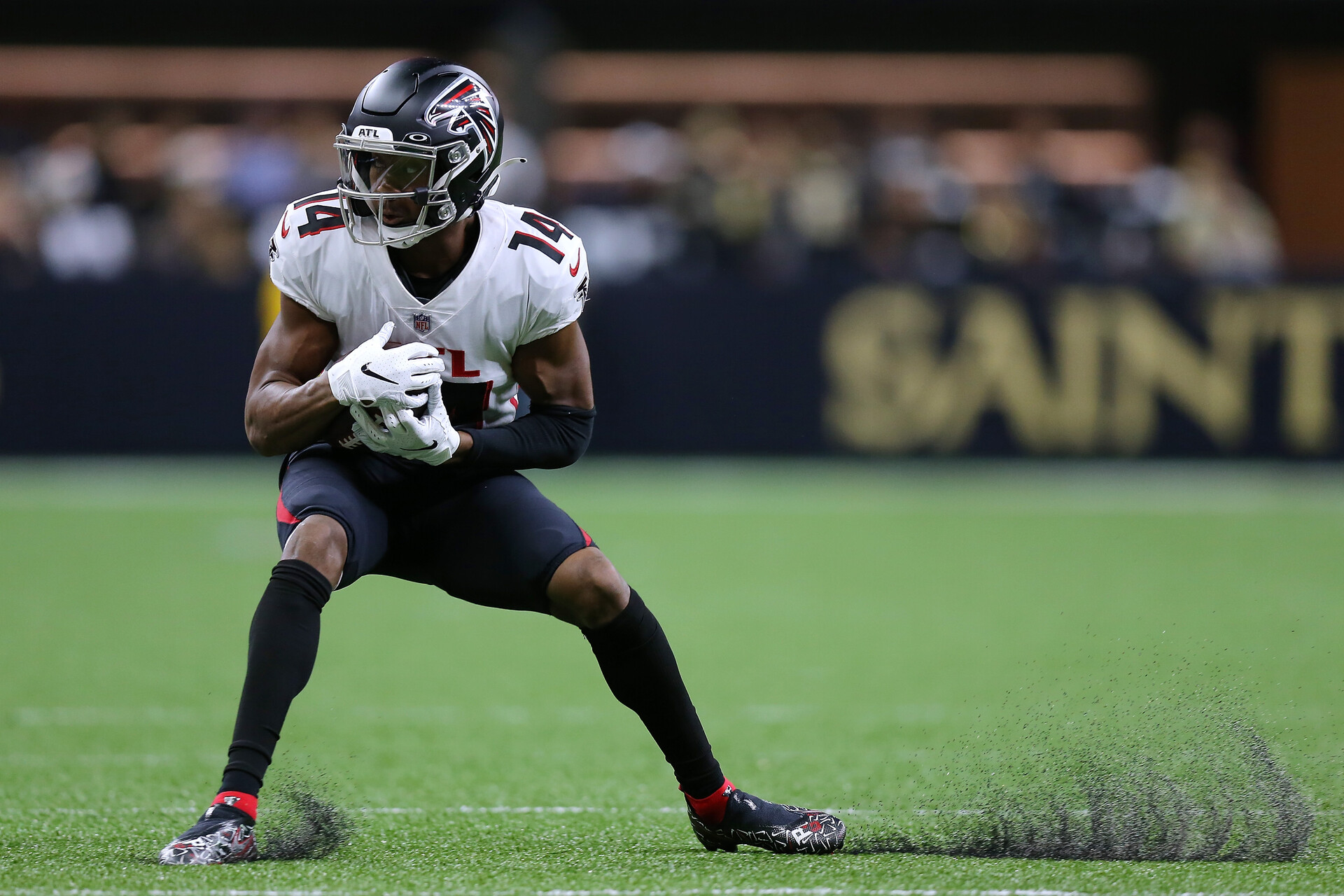 Atlanta Falcons wide receiver #14 Russell Gage catches a pass against the Saints in 2021.
