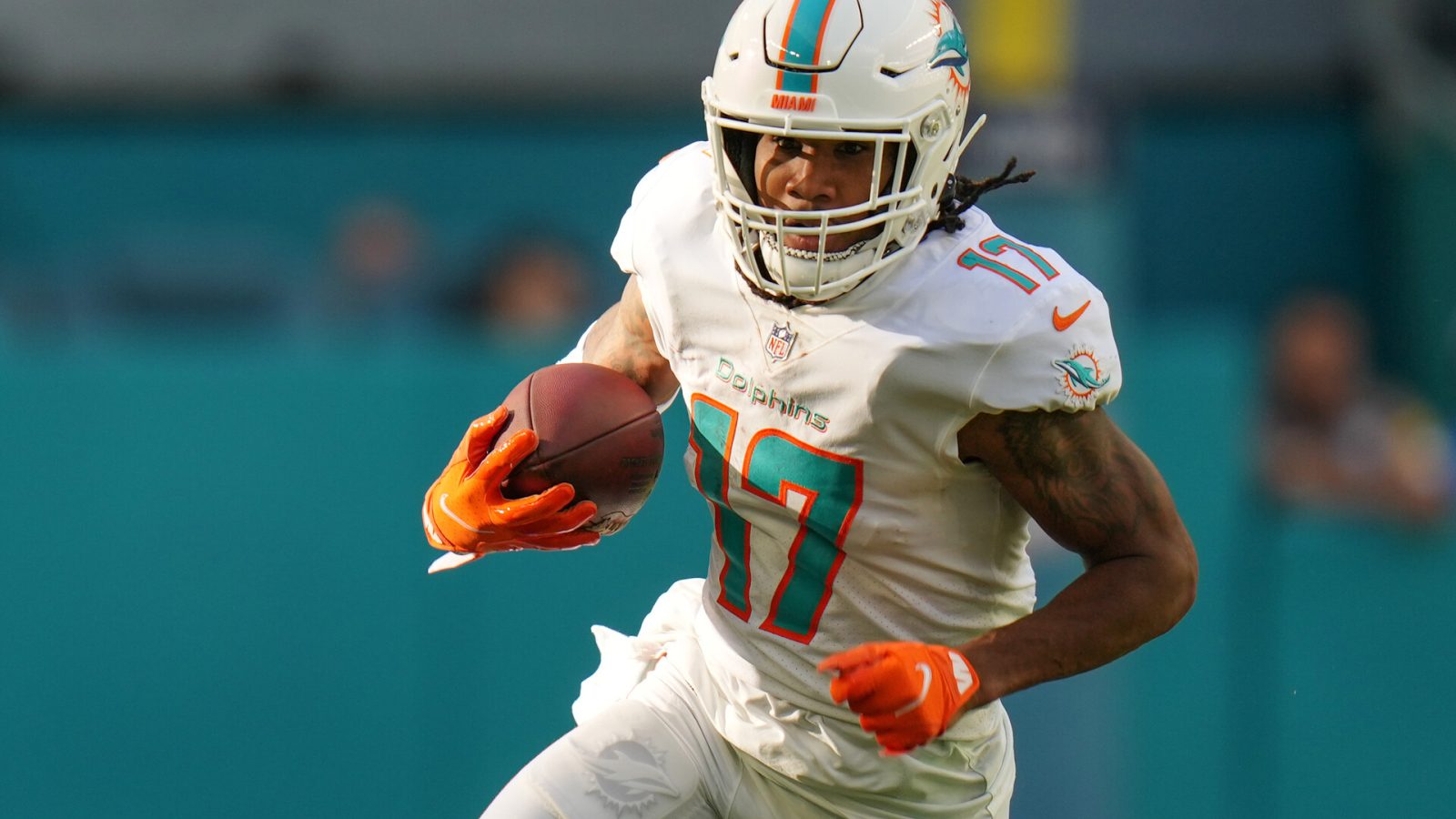 Jaylen Waddle #17 of the Miami Dolphins runs with the ball after making a catch against the Houston Texans at Hard Rock Stadium on November 07, 2021 in Miami Gardens, Florida.