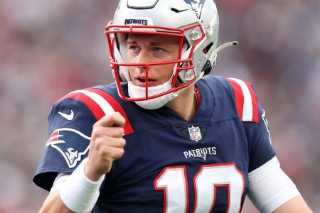 Mac Jones #10 of the New England Patriots celebrates the touchdown by Rhamondre Stevenson #38 against the Cleveland Browns during the third quarter at Gillette Stadium on November 14, 2021 in Foxborough, Massachusetts.