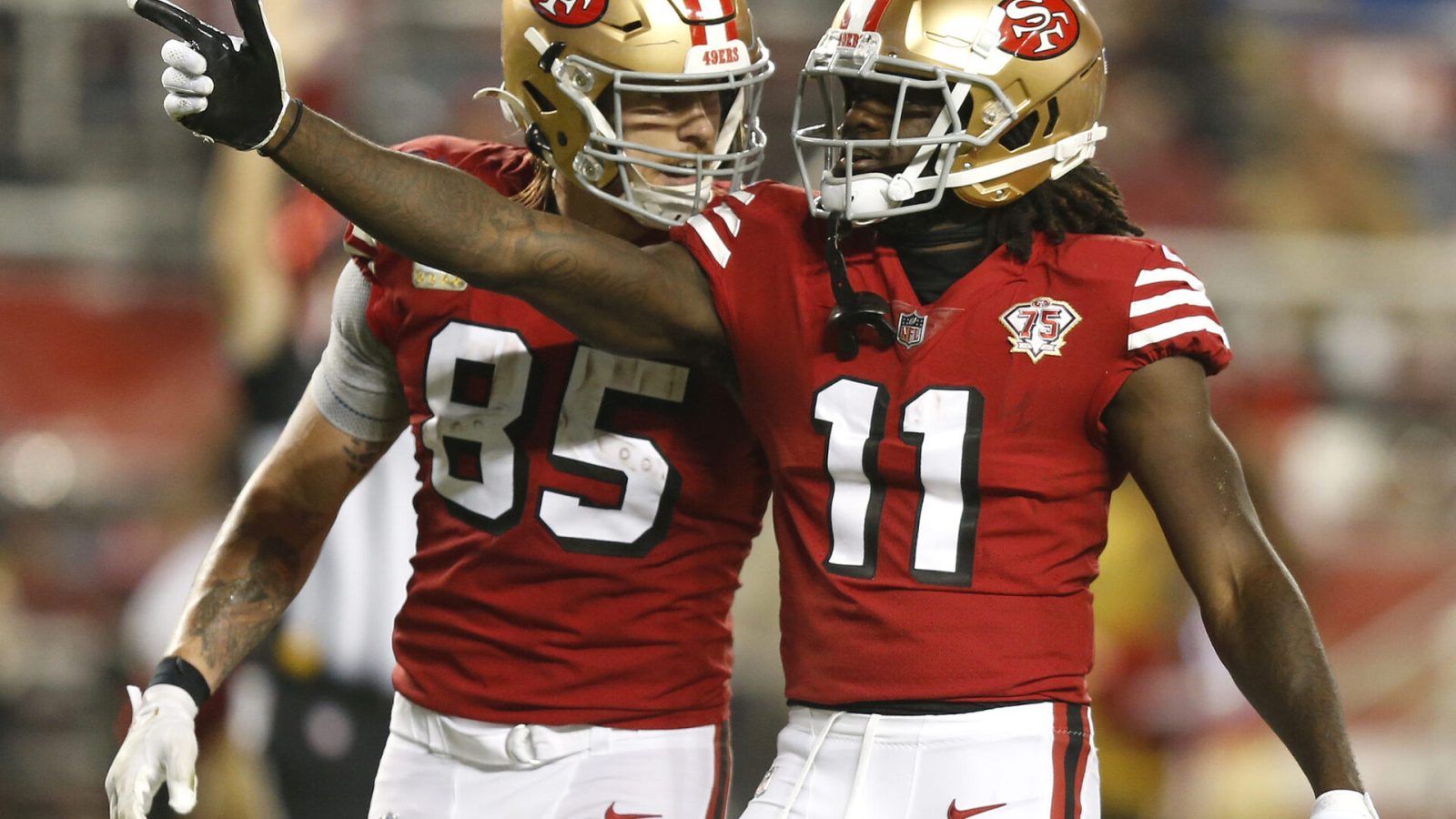 Brandon Aiyuk #11 celebrates with teammate George Kittle #85 of the San Francisco 49ers after getting a touchdown in the second half of the game against the Los Angeles Rams at Levi's Stadium on November 15, 2021 in Santa Clara, California.