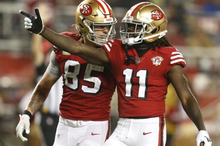 Brandon Aiyuk #11 celebrates with teammate George Kittle #85 of the San Francisco 49ers after getting a touchdown in the second half of the game against the Los Angeles Rams at Levi's Stadium on November 15, 2021 in Santa Clara, California.