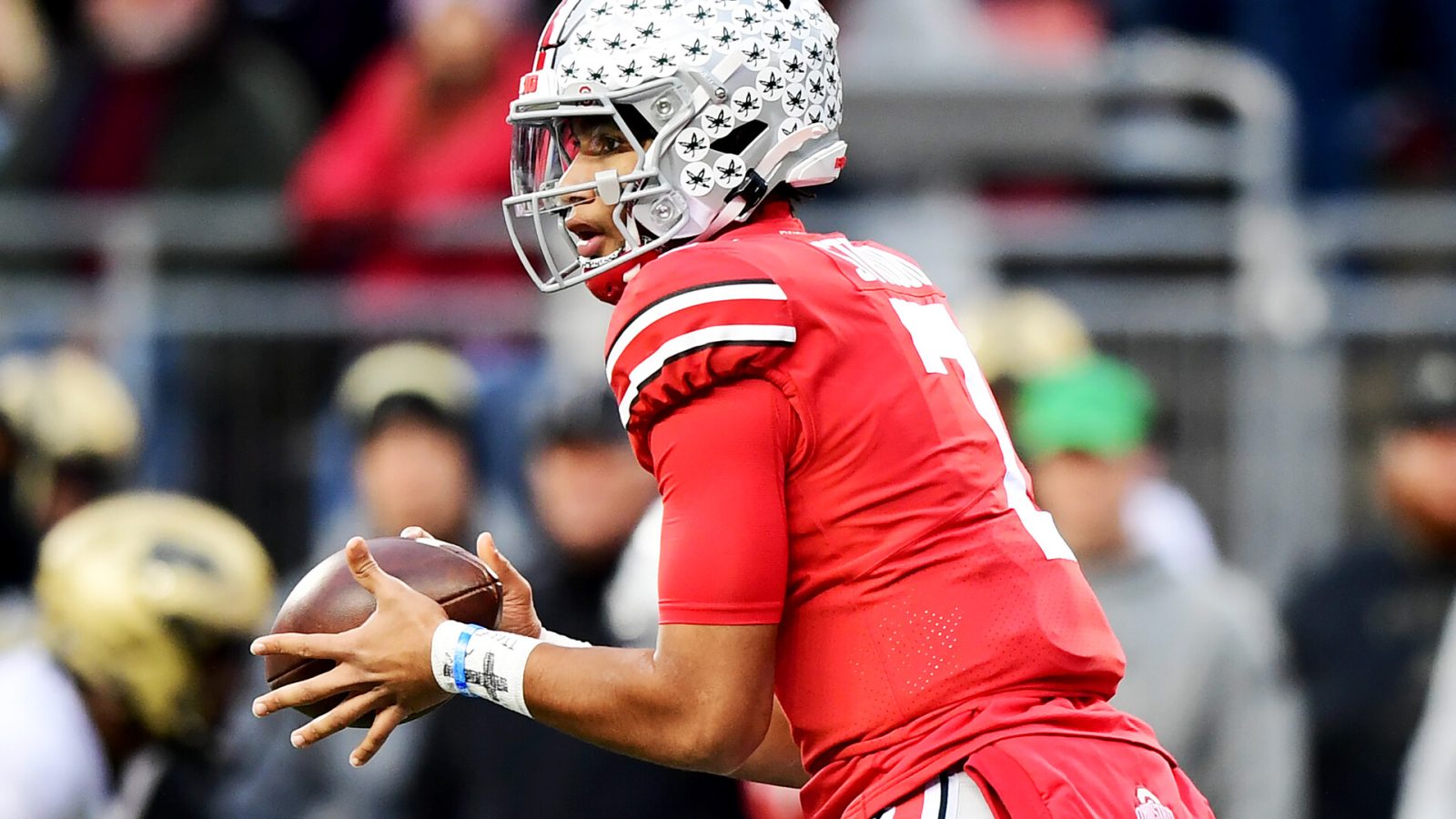 C.J. Stroud #7 of the Ohio State Buckeyes catches the snap during the first half of a game against the Purdue Boilermakers at Ohio Stadium on November 13, 2021 in Columbus, Ohio
