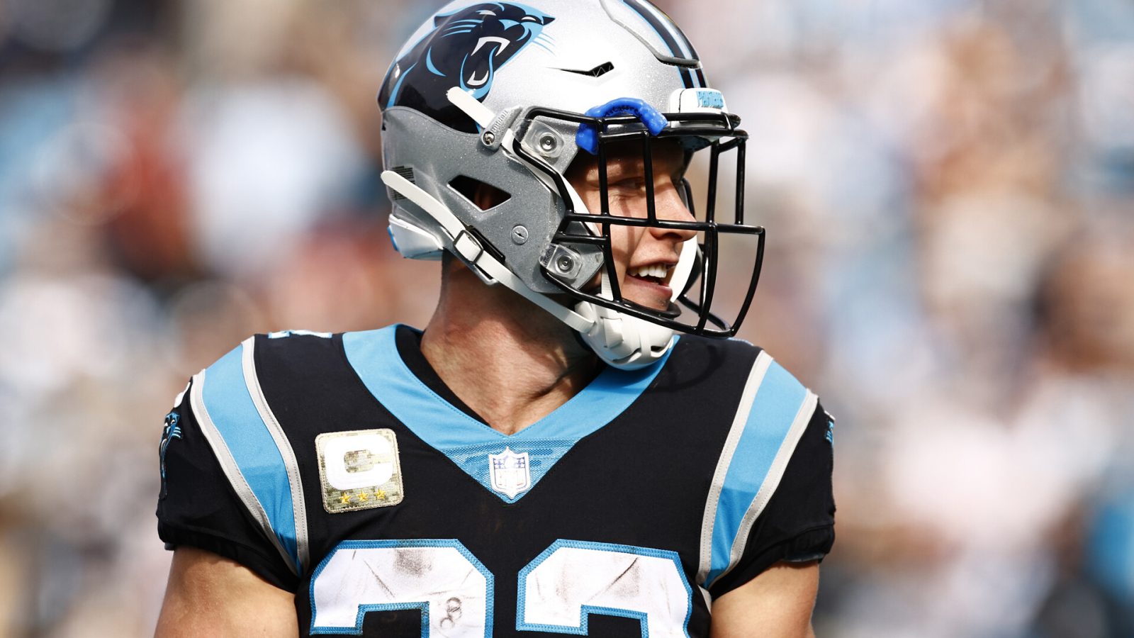 Christian McCaffrey #22 of the Carolina Panthers looks on during the first half of their game against the Washington Football Team at Bank of America Stadium on November 21, 2021 in Charlotte, North Carolina.