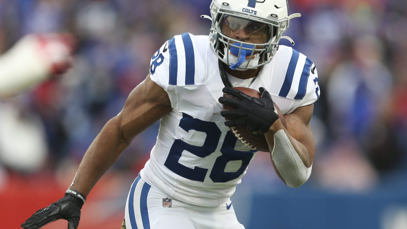 Jonathan Taylor #28 of the Indianapolis Colts rushes during the first half against the Buffalo Bills at Highmark Stadium on November 21, 2021 in Orchard Park, New York.