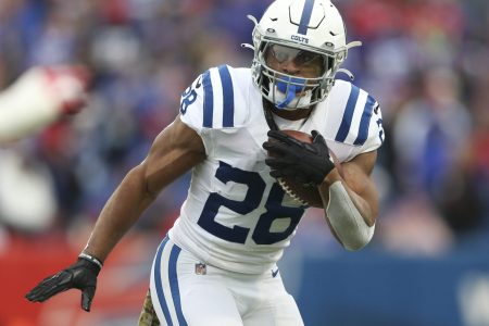 Jonathan Taylor #28 of the Indianapolis Colts rushes during the first half against the Buffalo Bills at Highmark Stadium on November 21, 2021 in Orchard Park, New York.