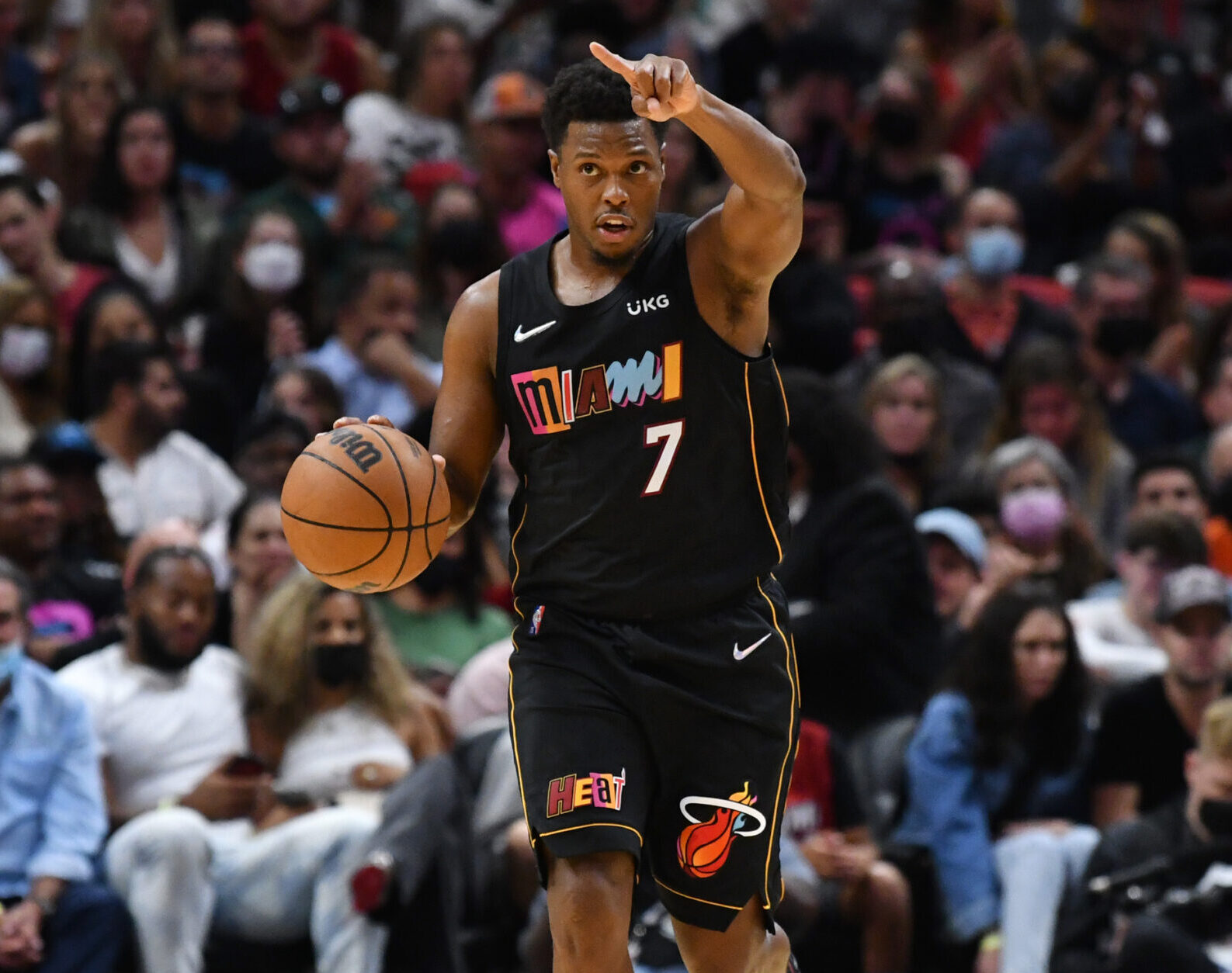 Miami Heat guard Kyle Lowry brings the ball up the court against the Utah Jazz during