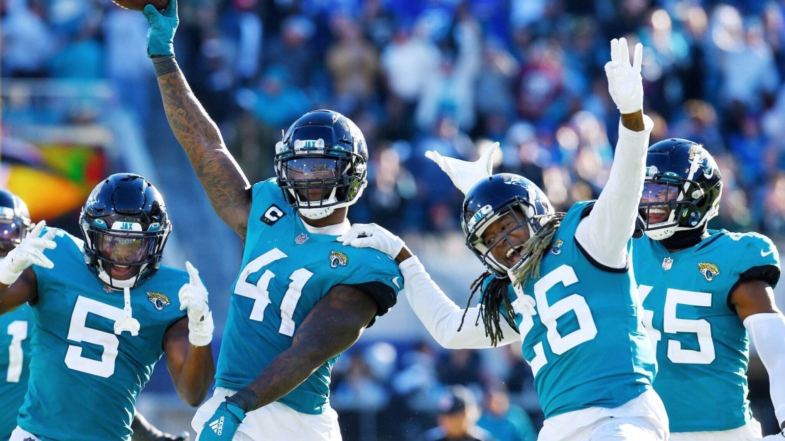 Jacksonville Jaguars linebacker Josh Allen (41), safety Rudy Ford (5) and cornerback Shaquill Griffin (26) and other teammates celebrate after Allen's recovery of a Buffalo fumble