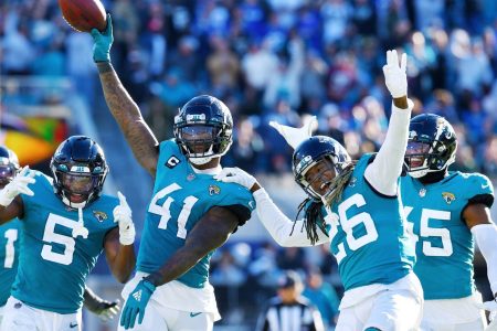 Jacksonville Jaguars linebacker Josh Allen (41), safety Rudy Ford (5) and cornerback Shaquill Griffin (26) and other teammates celebrate after Allen's recovery of a Buffalo fumble