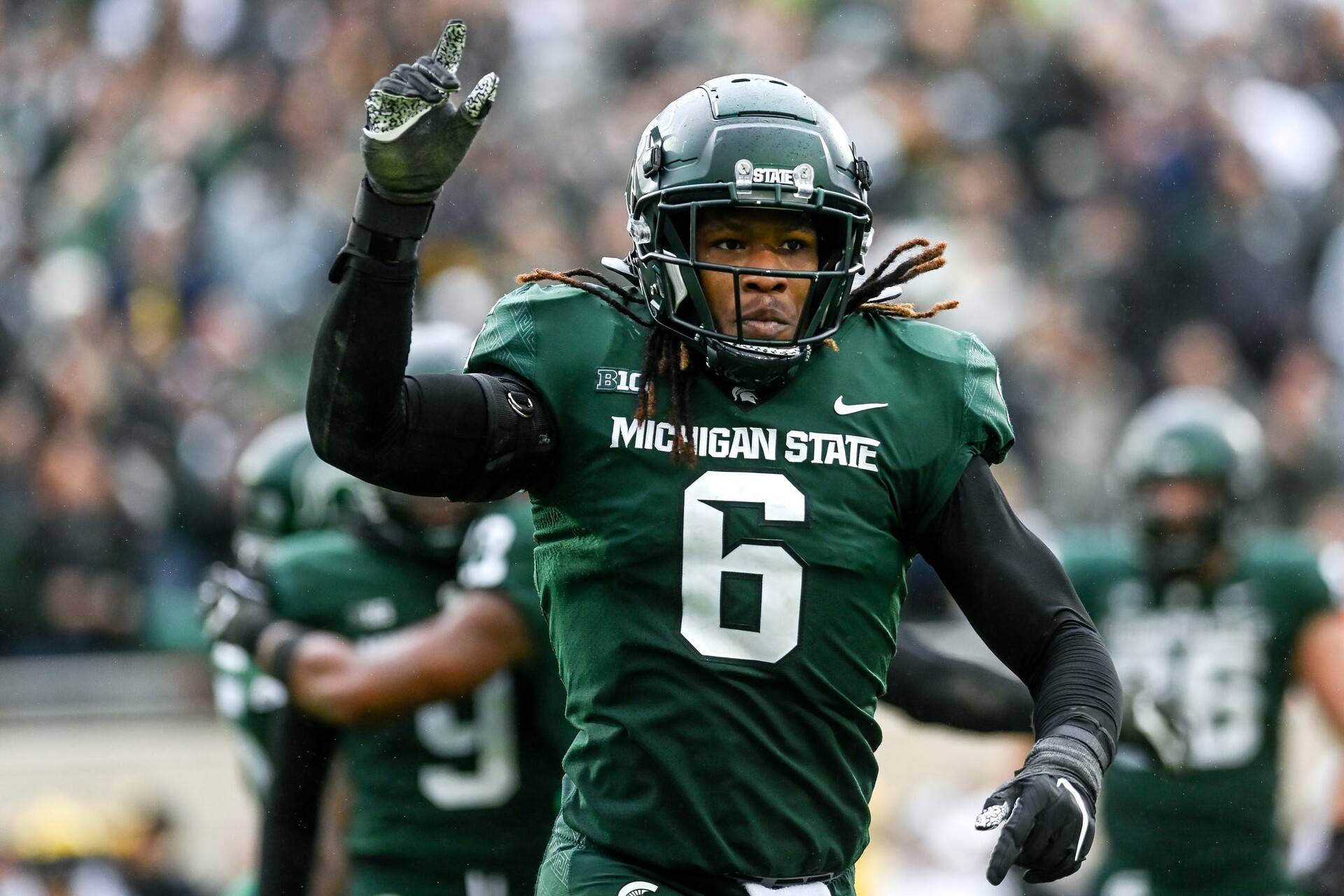 Michigan State's Quavaris Crouch celebrates a tackle against Michigan