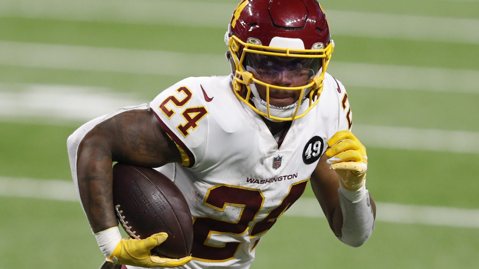 Washington Football Team running back Antonio Gibson (24) runs the ball for a touchdown during the fourth quarter against the Detroit Lions at Ford Field.