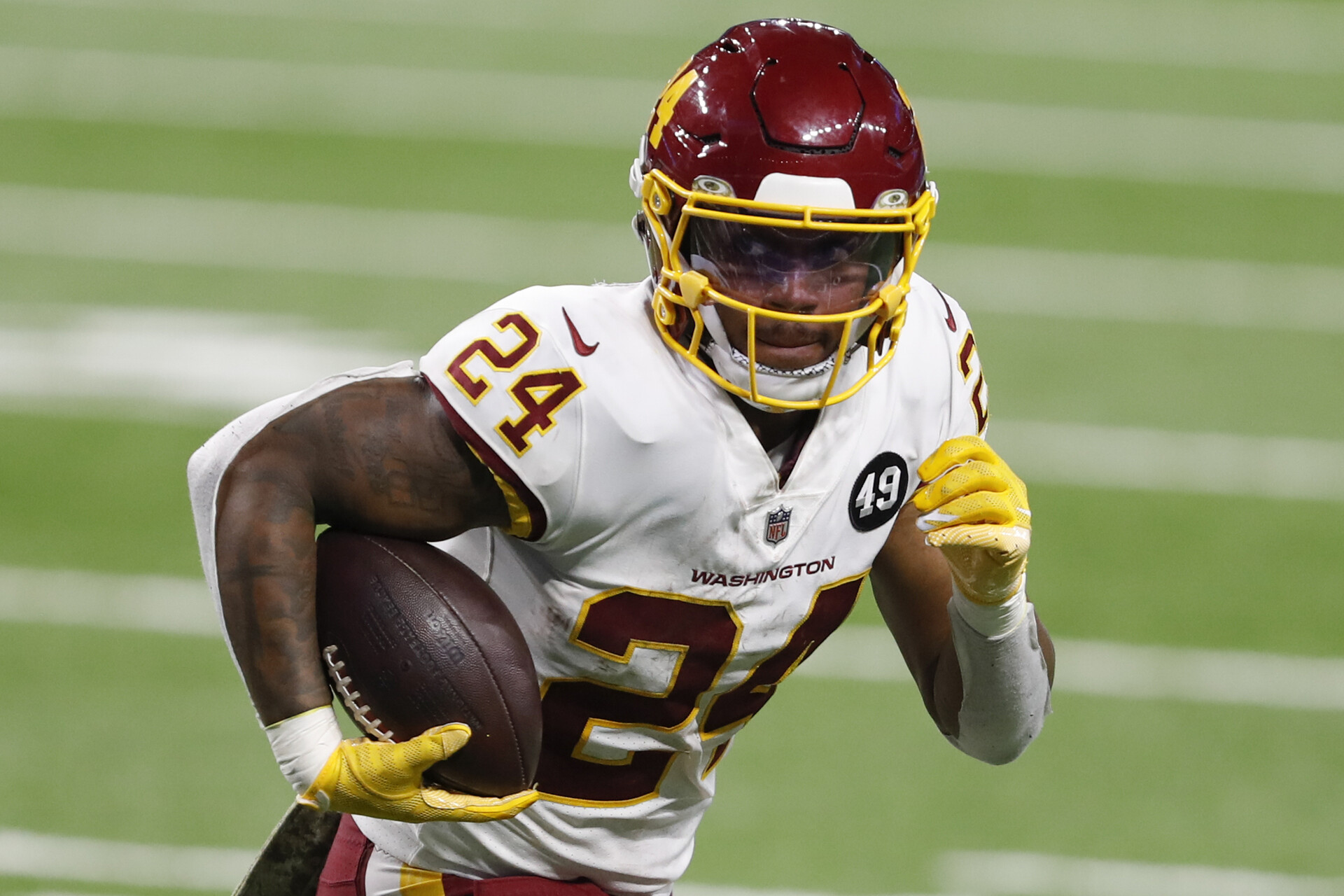Washington Football Team running back Antonio Gibson (24) runs the ball for a touchdown during the fourth quarter against the Detroit Lions at Ford Field.
