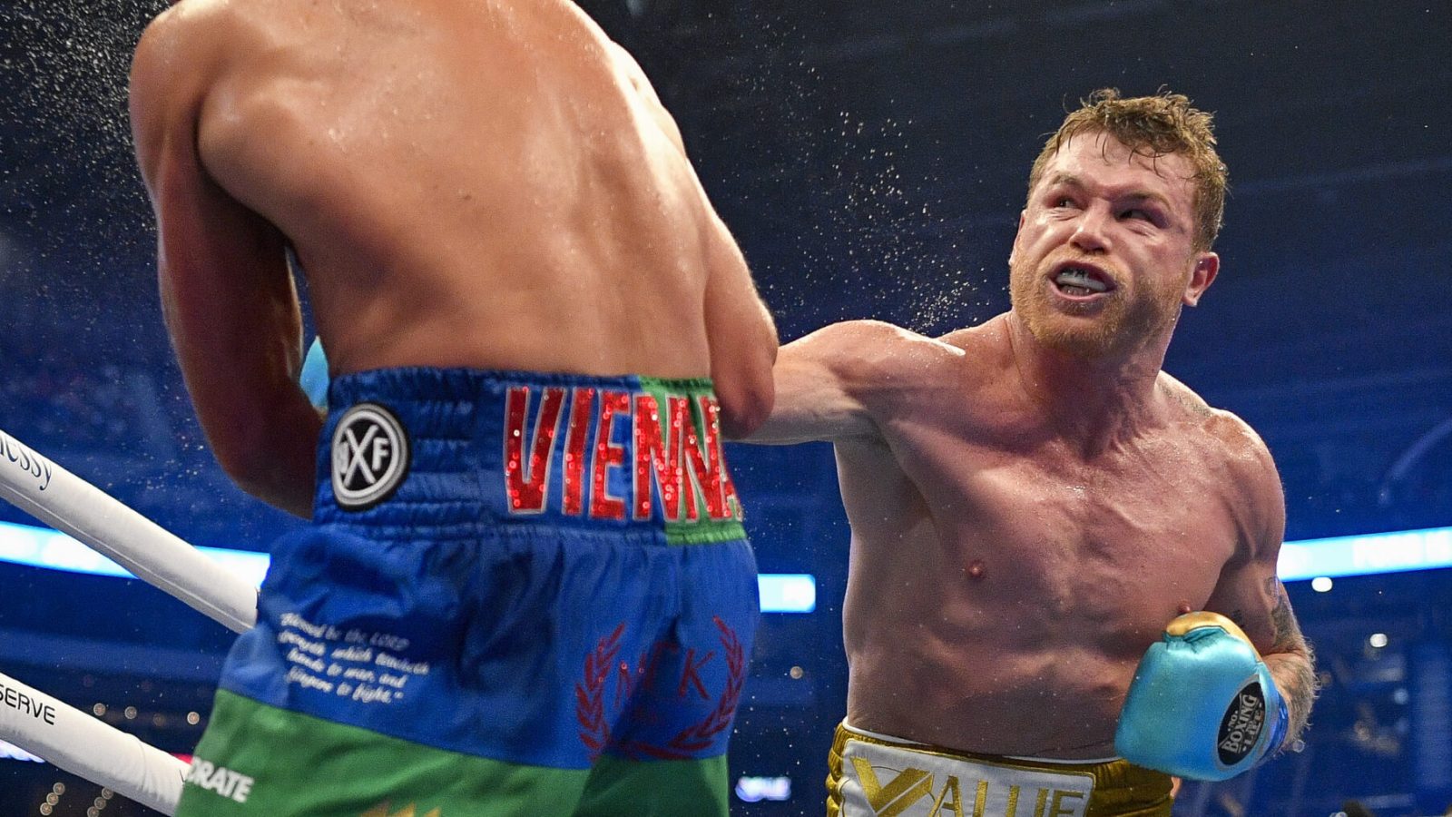 Canelo Alvarez connects with a punch against Billy Joe Saunders during a super middleweight boxing title fight