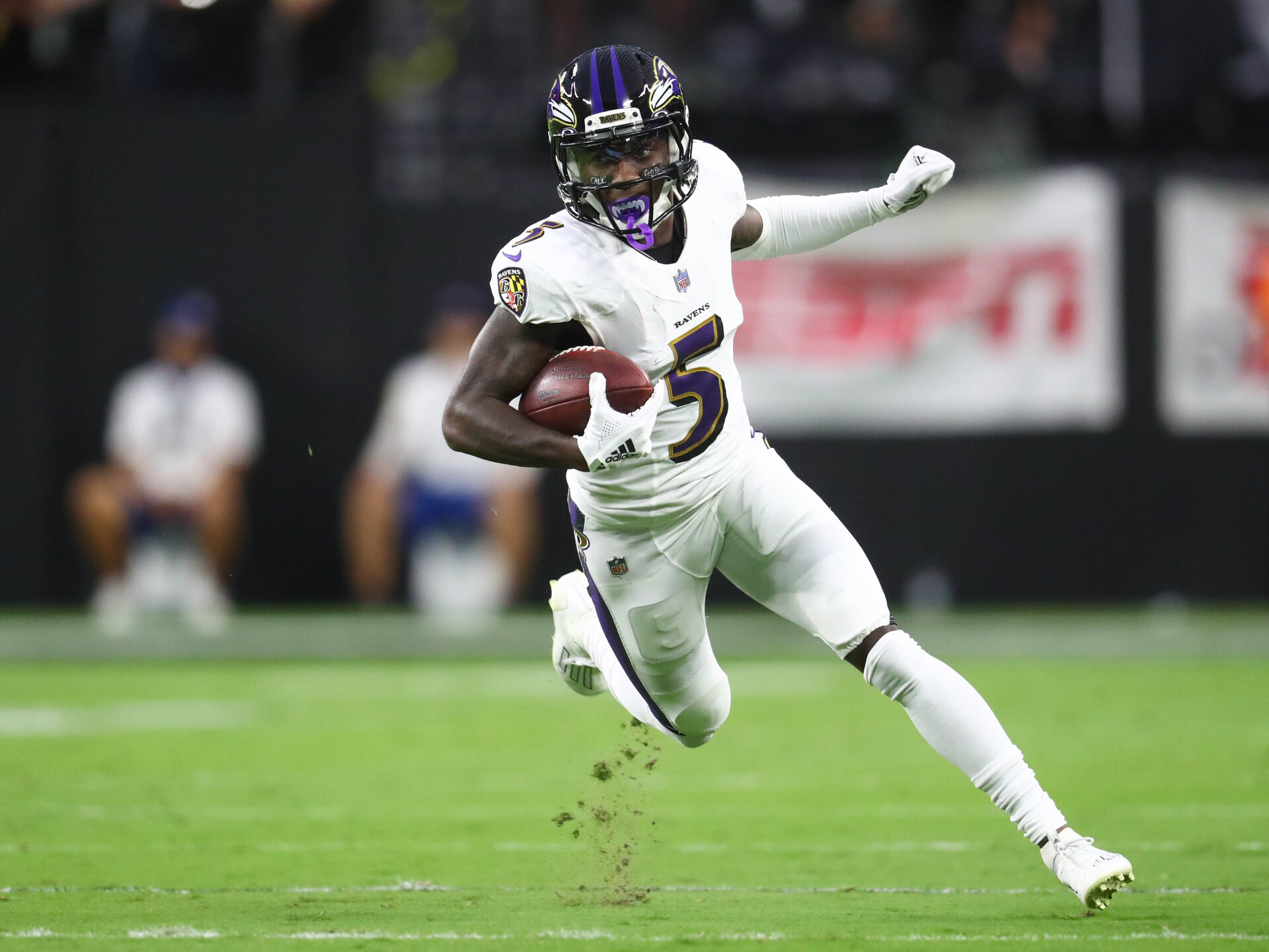 Baltimore Ravens wide receiver Marquise Brown (5) runs the ball against the Las Vegas Raiders during the first half at Allegiant Stadium.