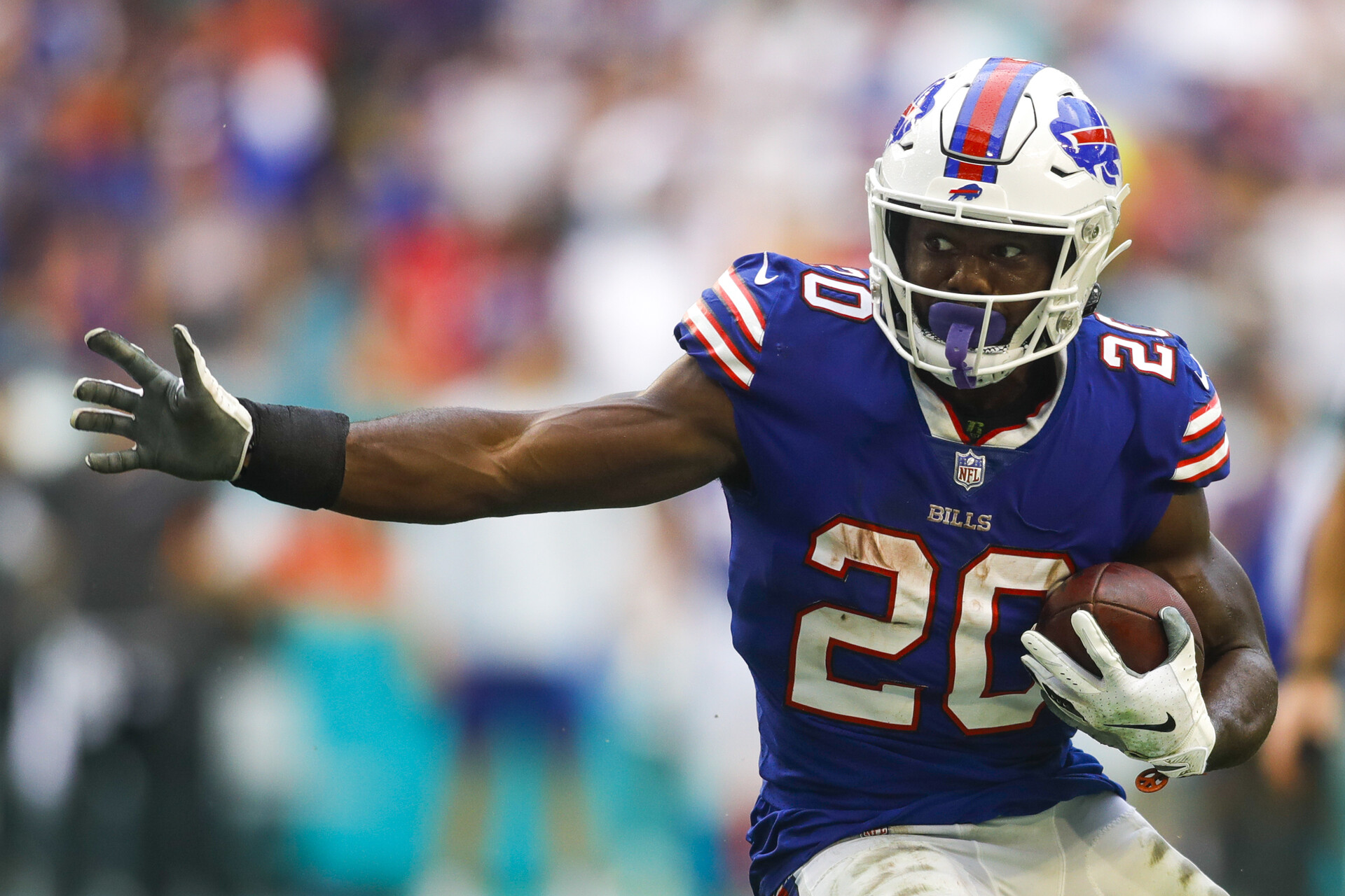 Buffalo Bills running back Zack Moss (20) runs with the football to score a touchdown during the fourth quarter of the game against the Miami Dolphins at Hard Rock Stadium.