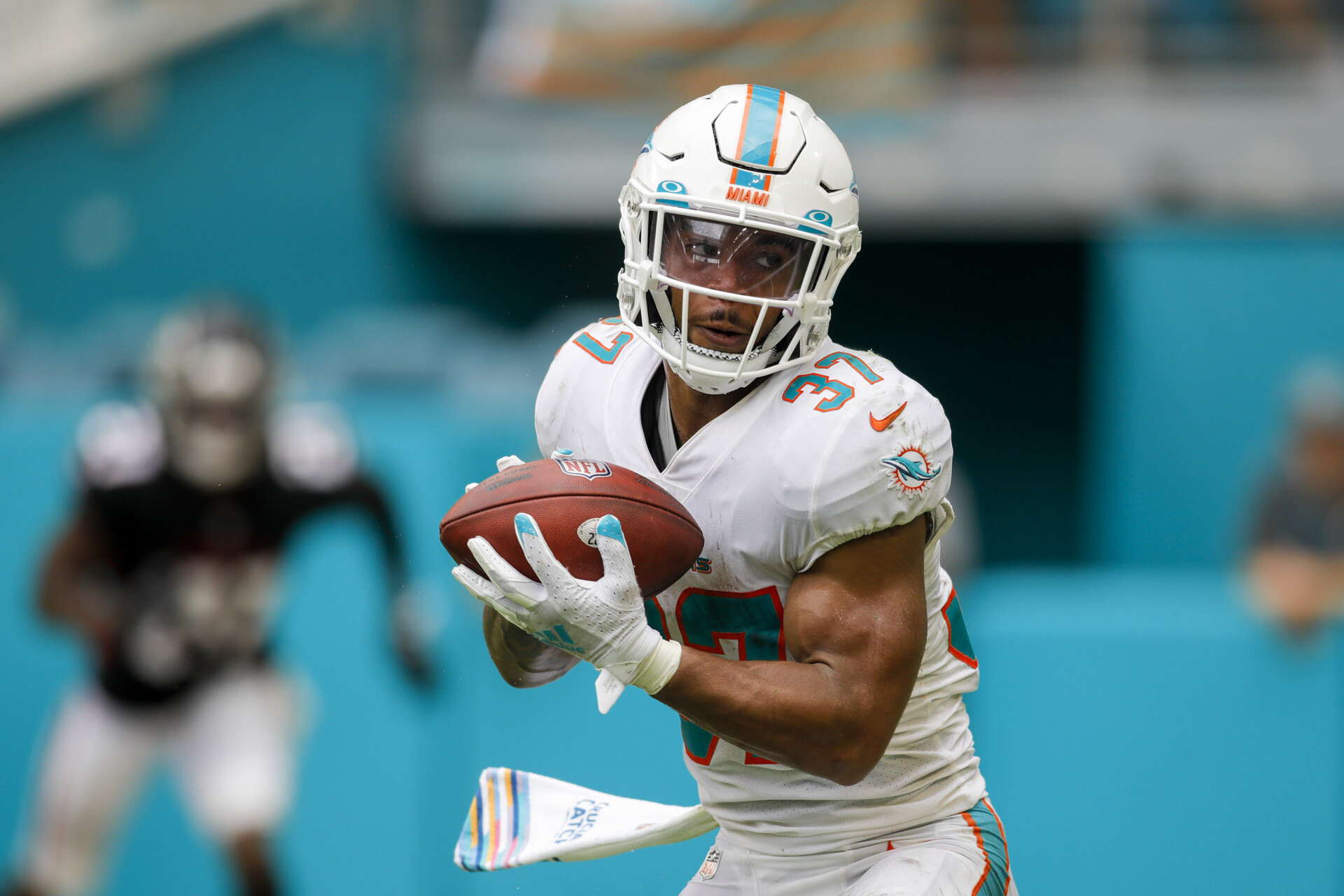Miami Gardens, Florida, USA; Miami Dolphins running back Myles Gaskin (37) runs with the football for a touchdown against the Atlanta Falcons during the fourth quarter of the game at Hard Rock Stadium.