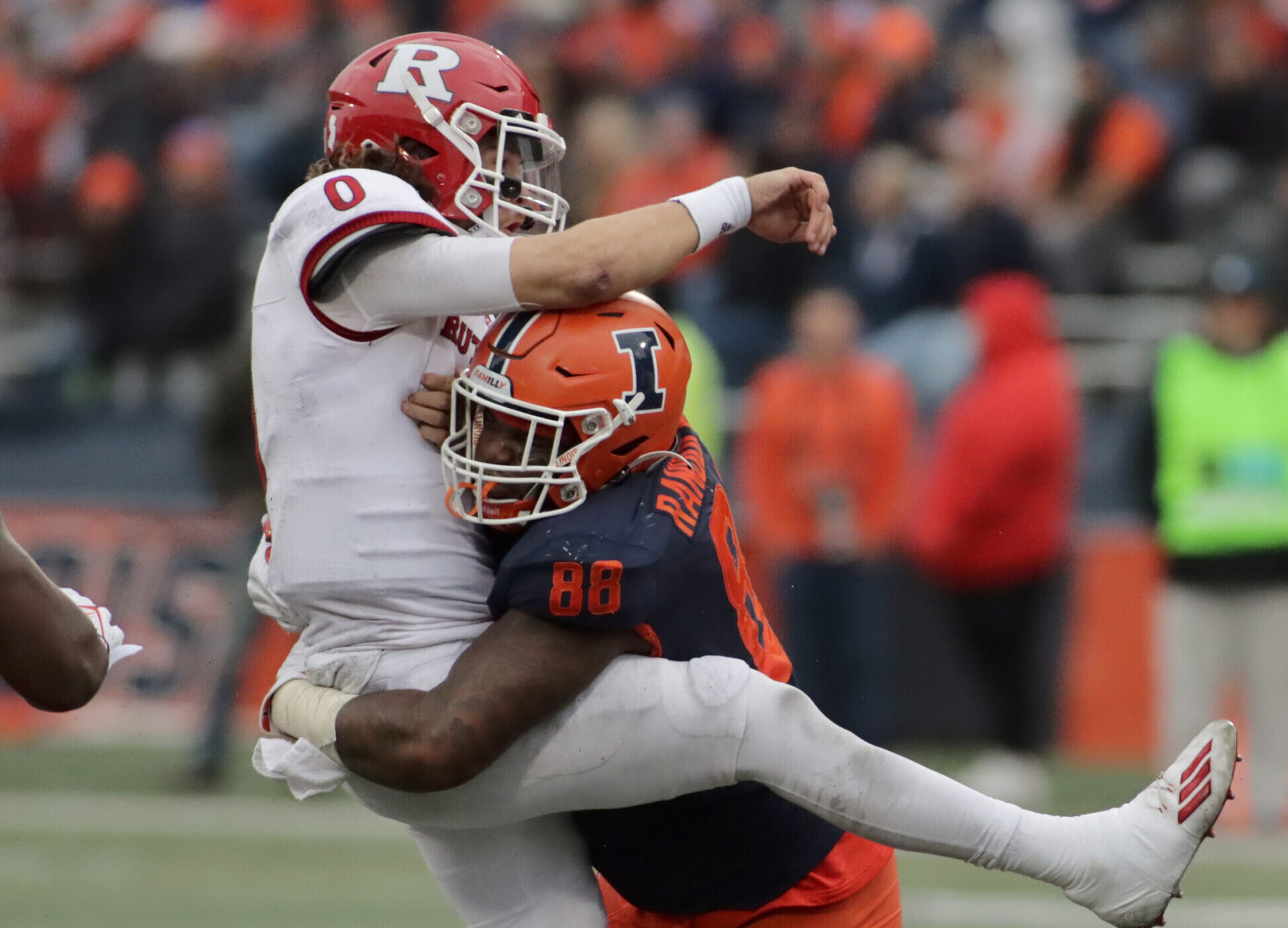 Illinois Fighting Illini defensive lineman Keith Randolph Jr. tackles Rutgers Scarlet Knights quarterback Noah Vedral