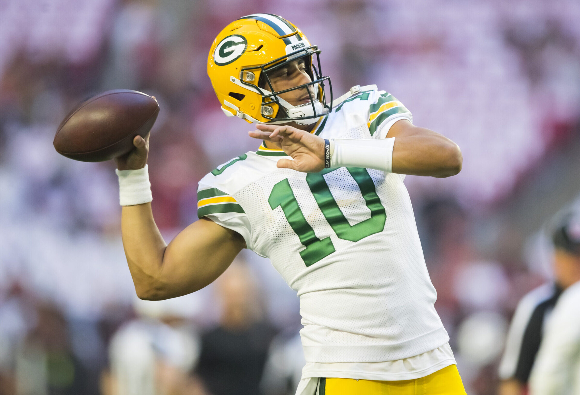 Green Bay Packers quarterback Jordan Love warms up before a game against the Arizona Cardinals