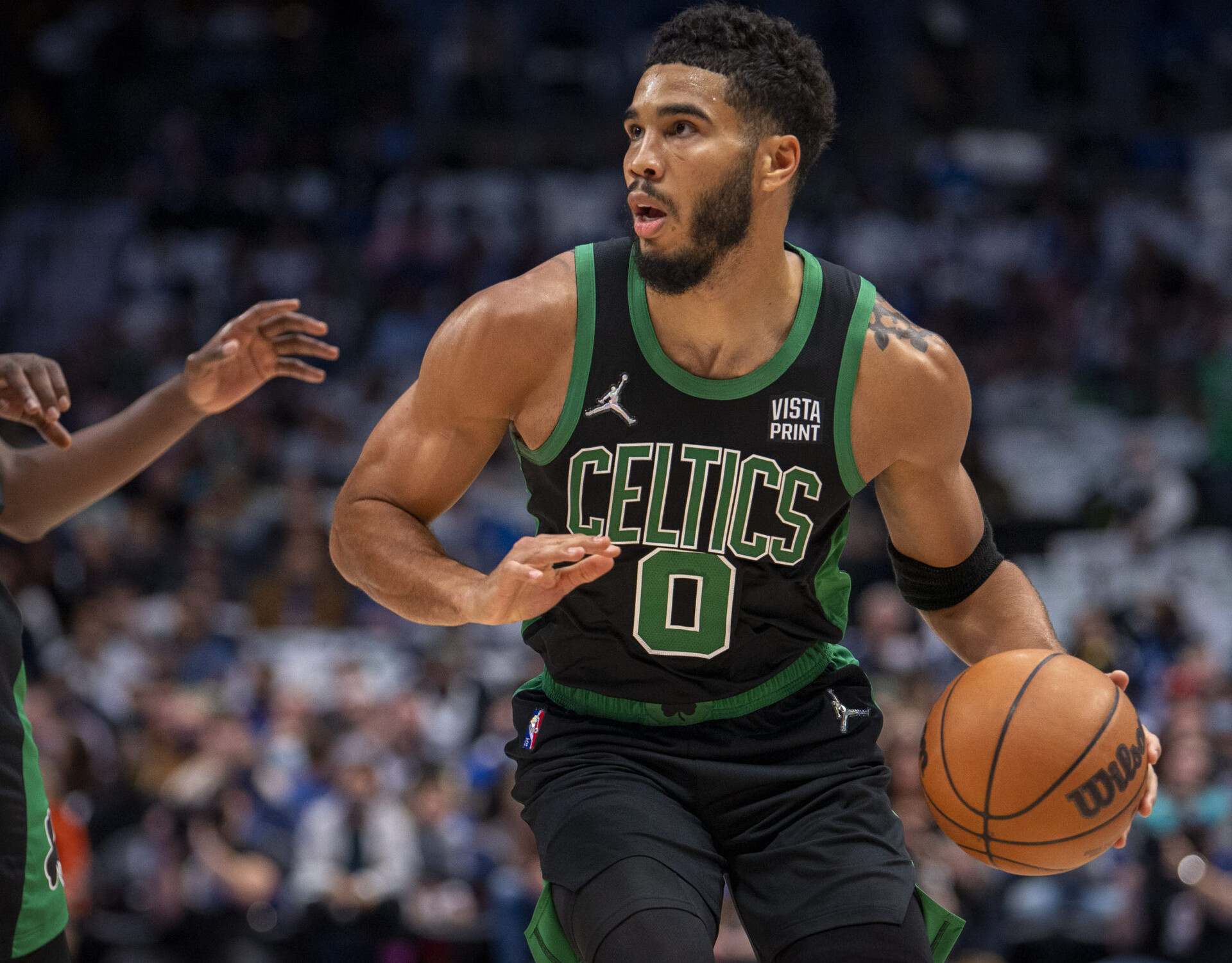 Boston Celtics forward Jayson Tatum brings the ball up court against the Dallas Mavericks.