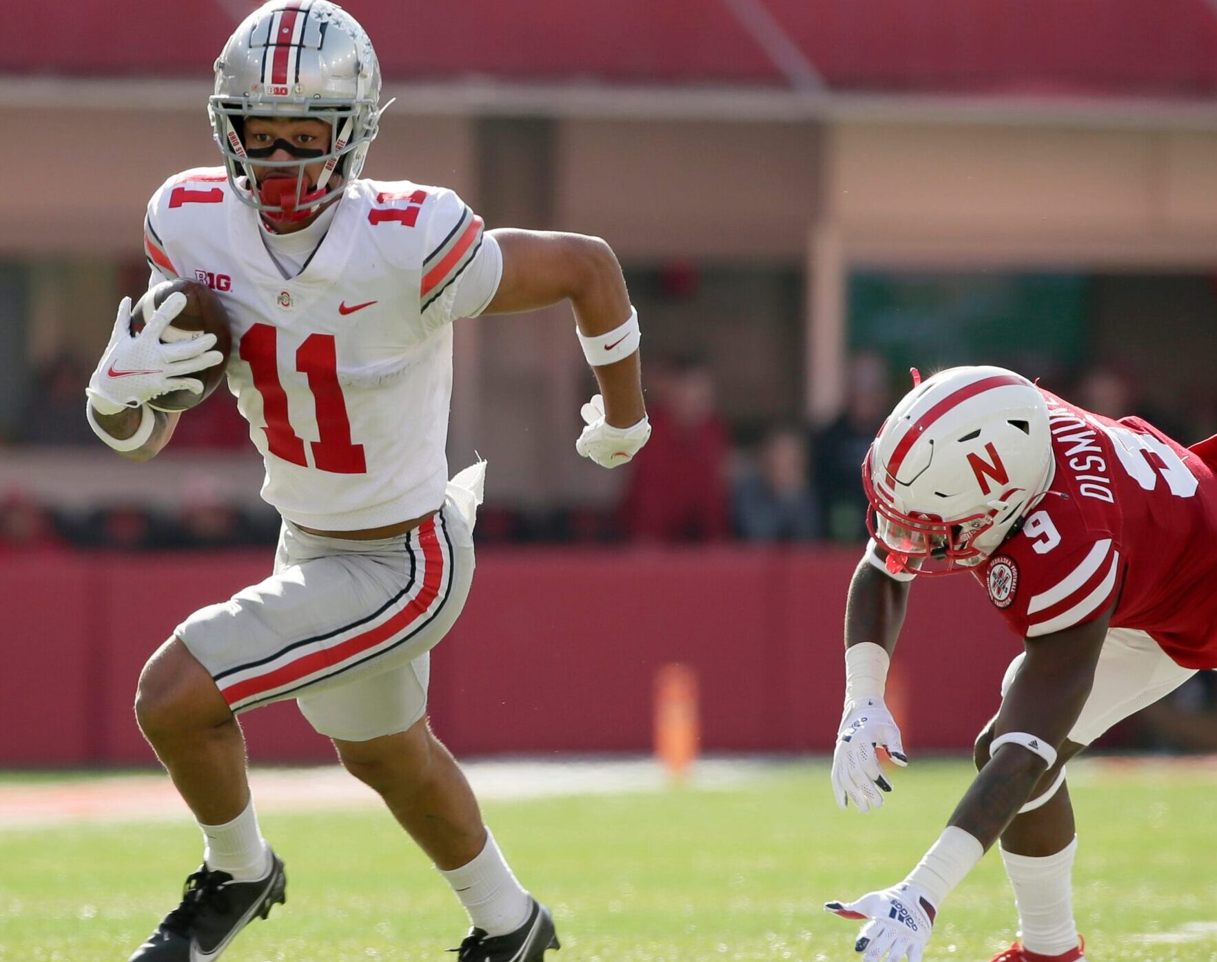 Ohio State Buckeyes wide receiver Jaxon Smith-Njigba (11) dashes past Nebraska Cornhuskers safety Marquel Dismuke (9)