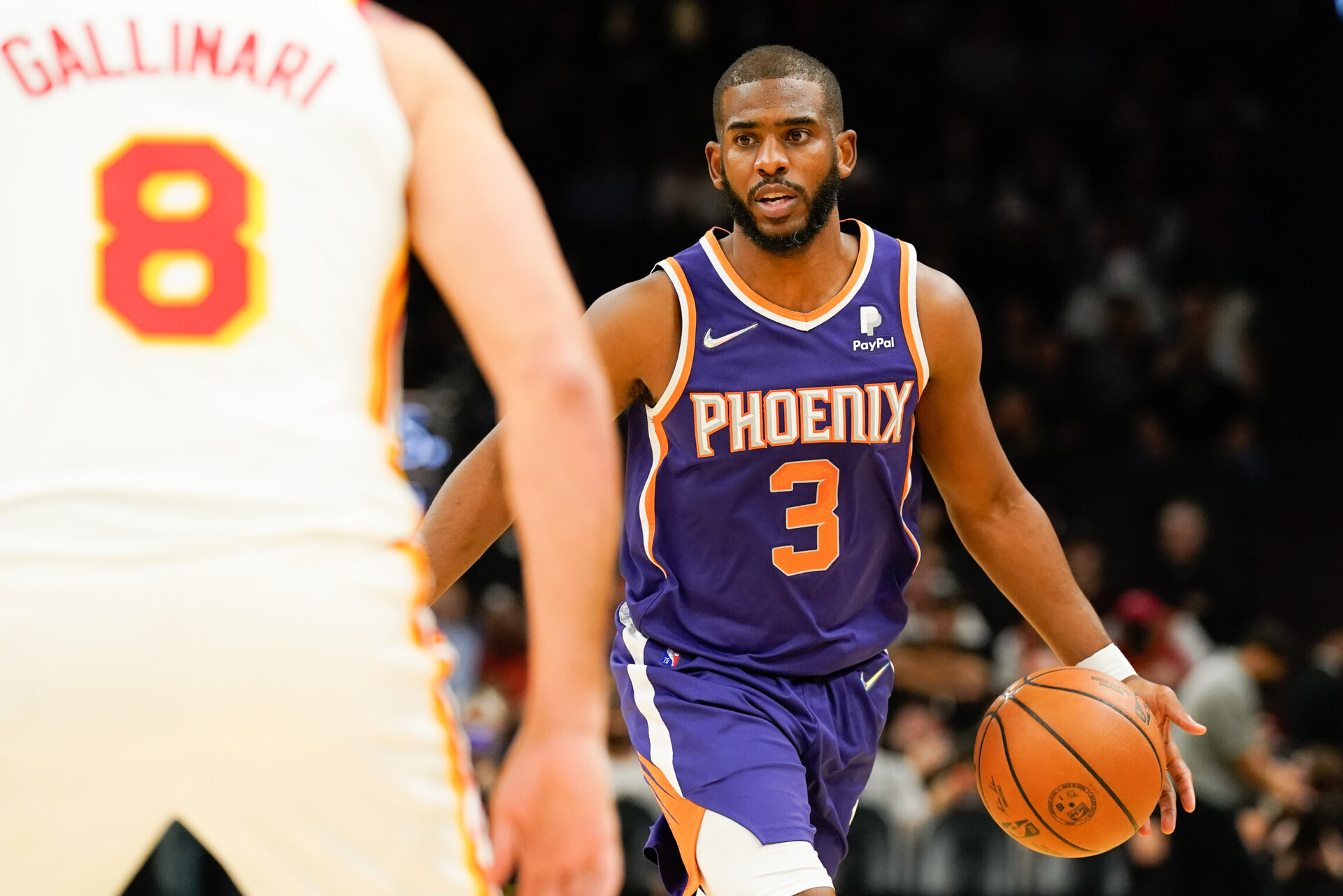 Phoenix Suns guard Chris Paul dribbles the ball up court against the Atlanta Hawks