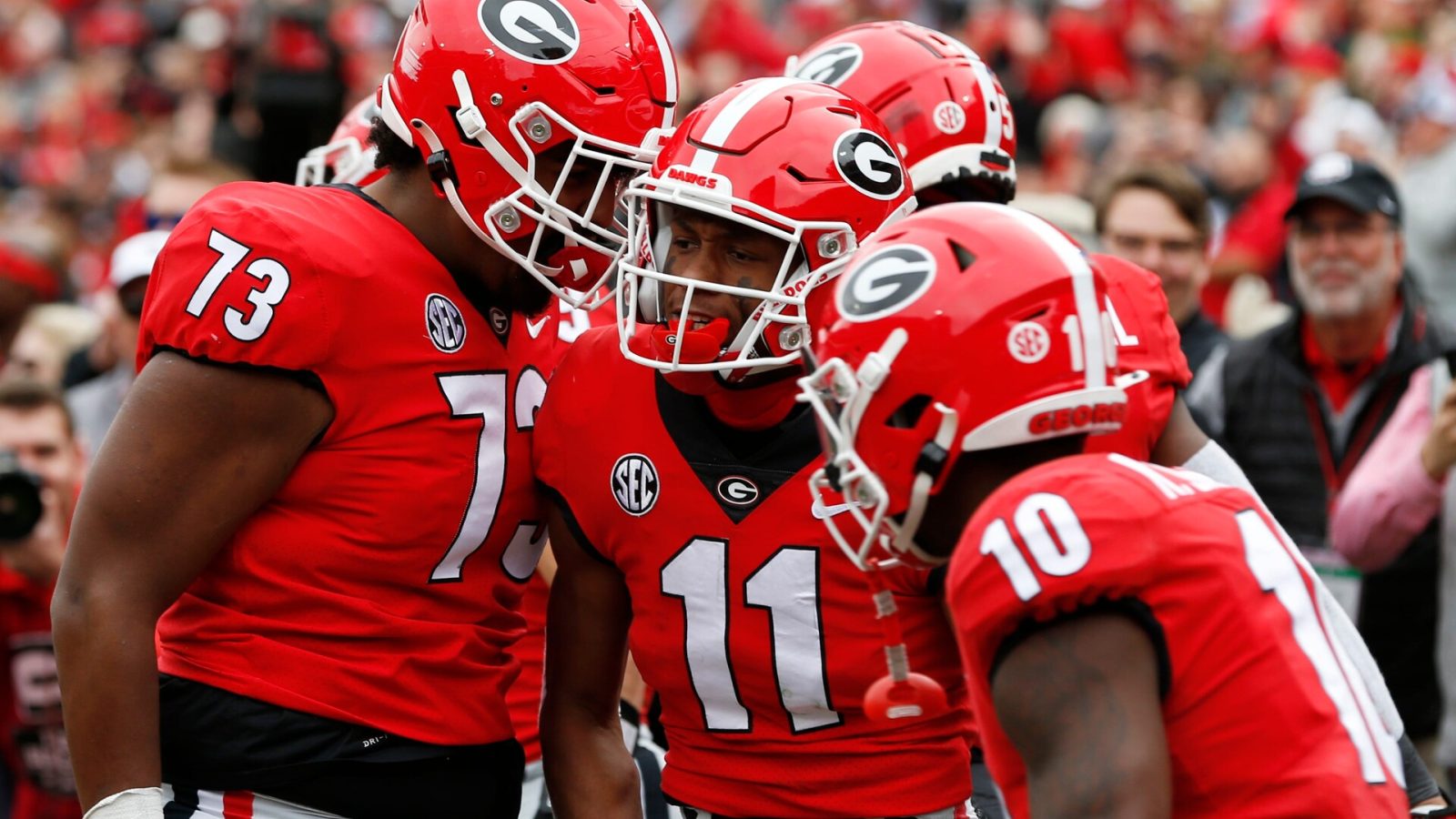 Georgia wide receiver Arian Smith (11) celebrates with his teammates after scoring a touchdown against Missouri