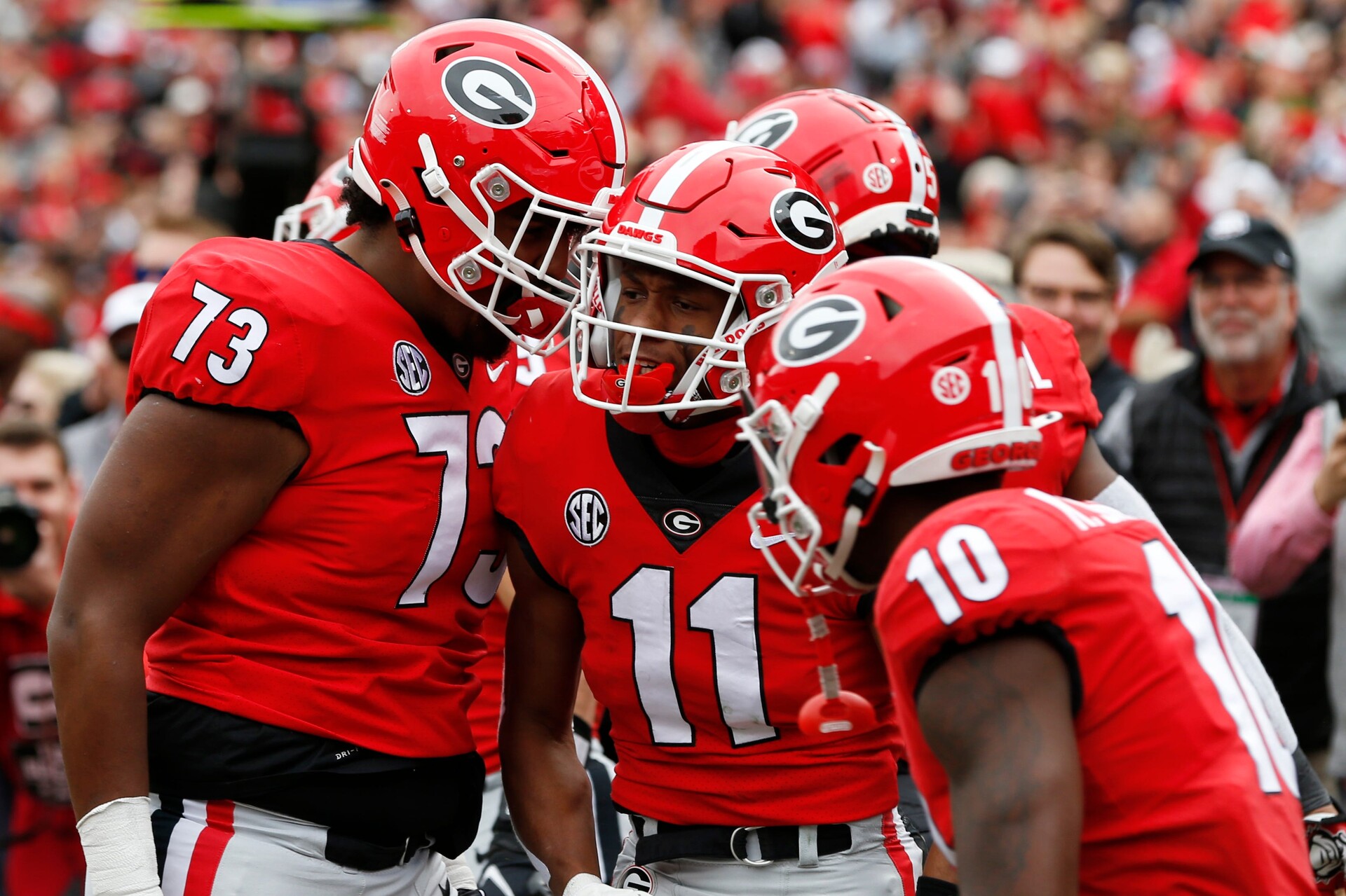 Georgia wide receiver Arian Smith (11) celebrates with his teammates after scoring a touchdown against Missouri