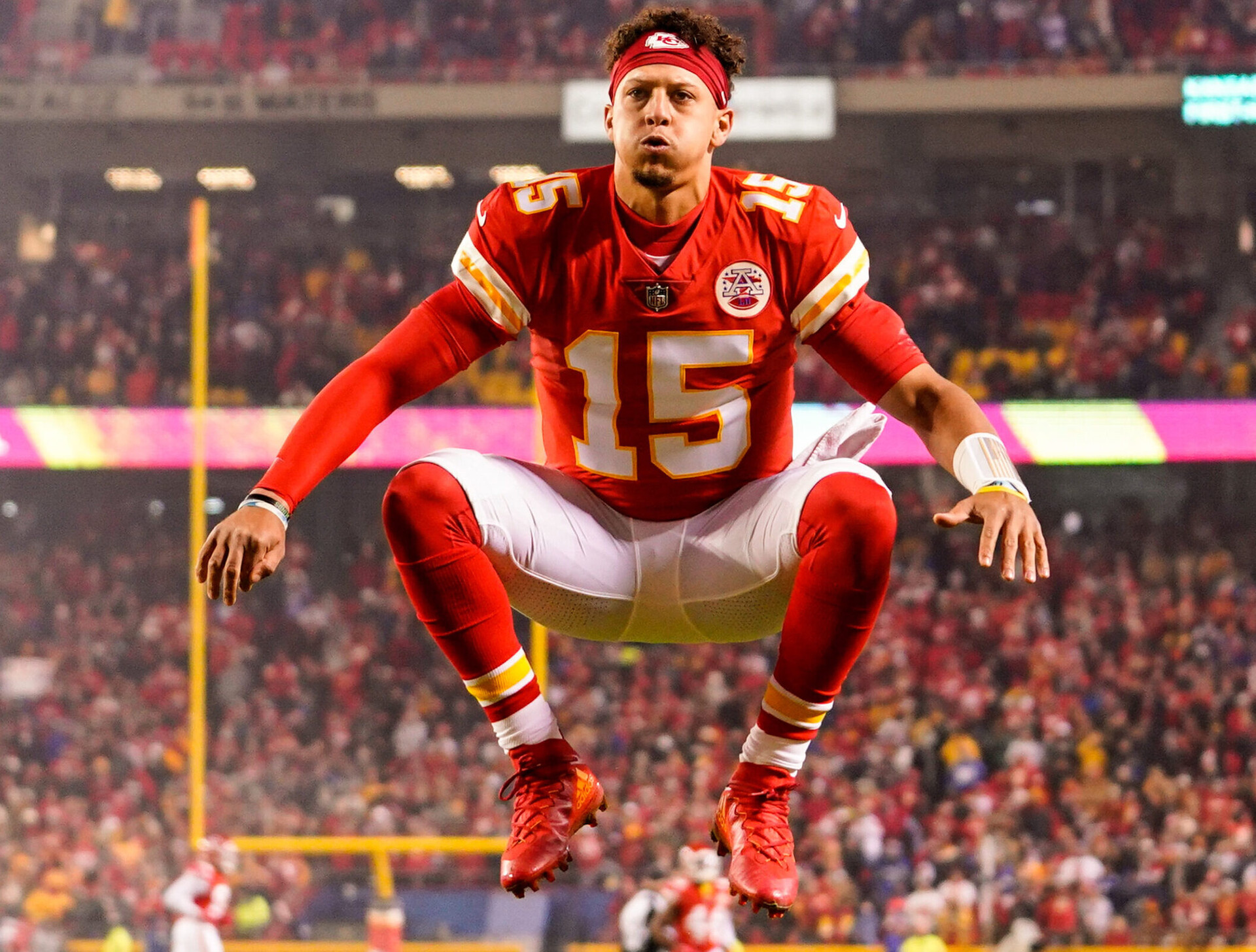 quarterback Patrick Mahomes jumps in the air before a game against the New York Giants