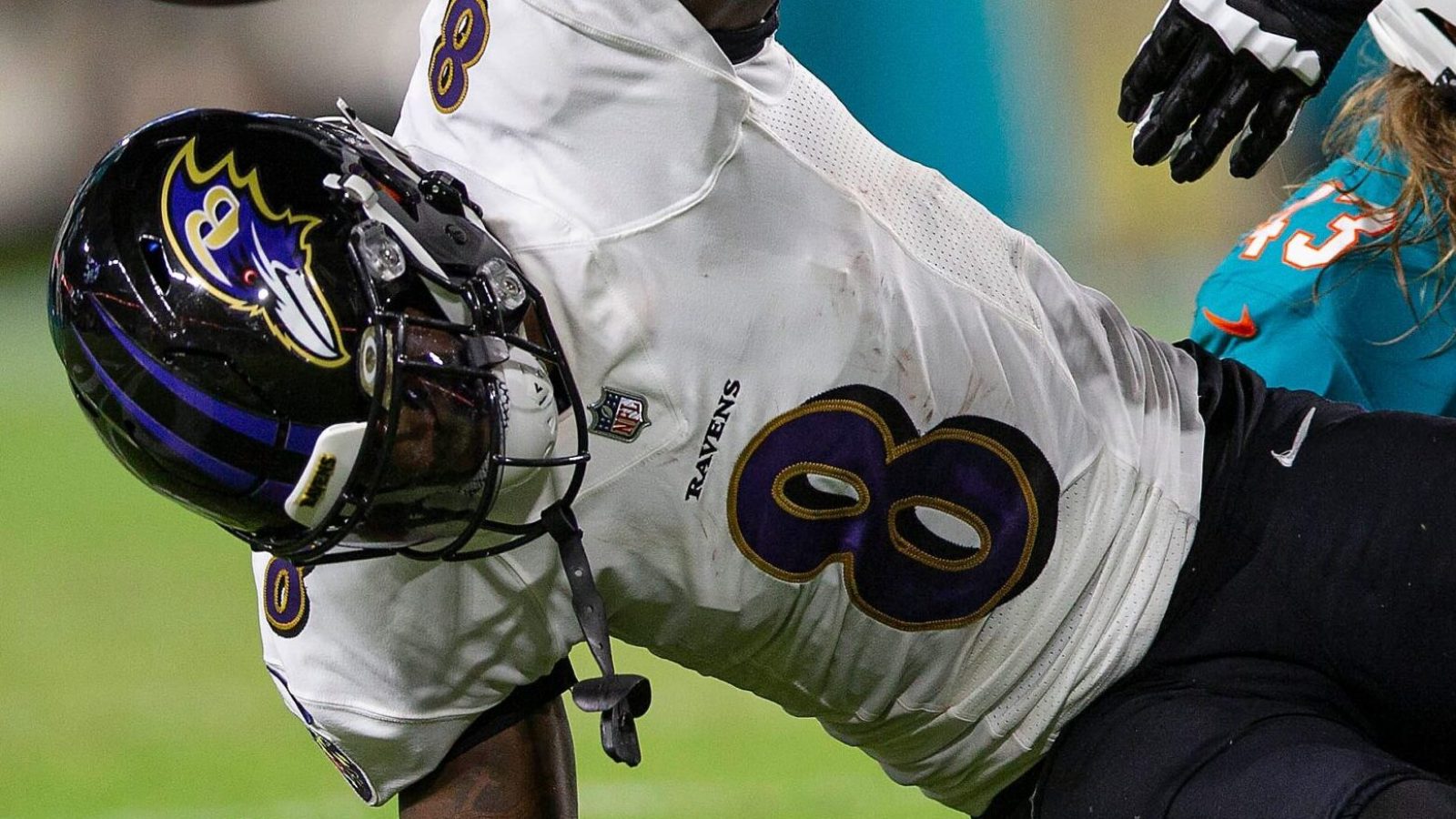 Baltimore Ravens quarterback Lamar Jackson (8), slams the ball after been sacked by Miami Dolphins outside linebacker Andrew Van Ginkel (43), late in the first quarter of their NFL game at Hard Rock Stadium Thursday in Miami Gardens.