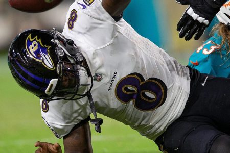 Baltimore Ravens quarterback Lamar Jackson (8), slams the ball after been sacked by Miami Dolphins outside linebacker Andrew Van Ginkel (43), late in the first quarter of their NFL game at Hard Rock Stadium Thursday in Miami Gardens.