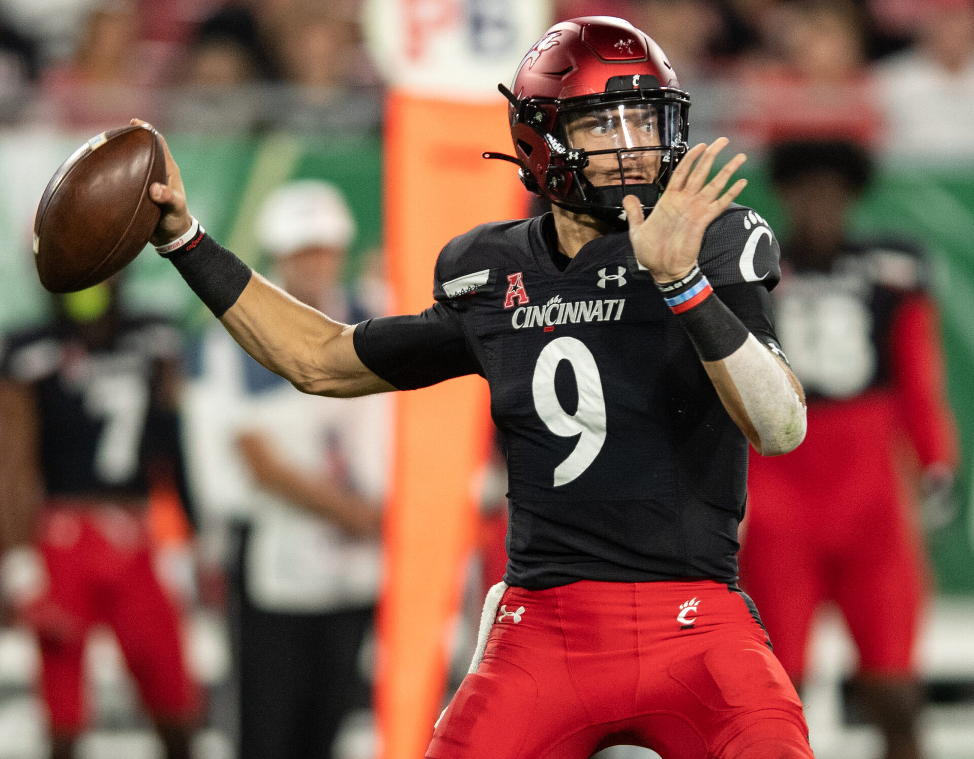 Cincinnati Bearcats quarterback Desmond Ridder throws the ball in a game against South Florida