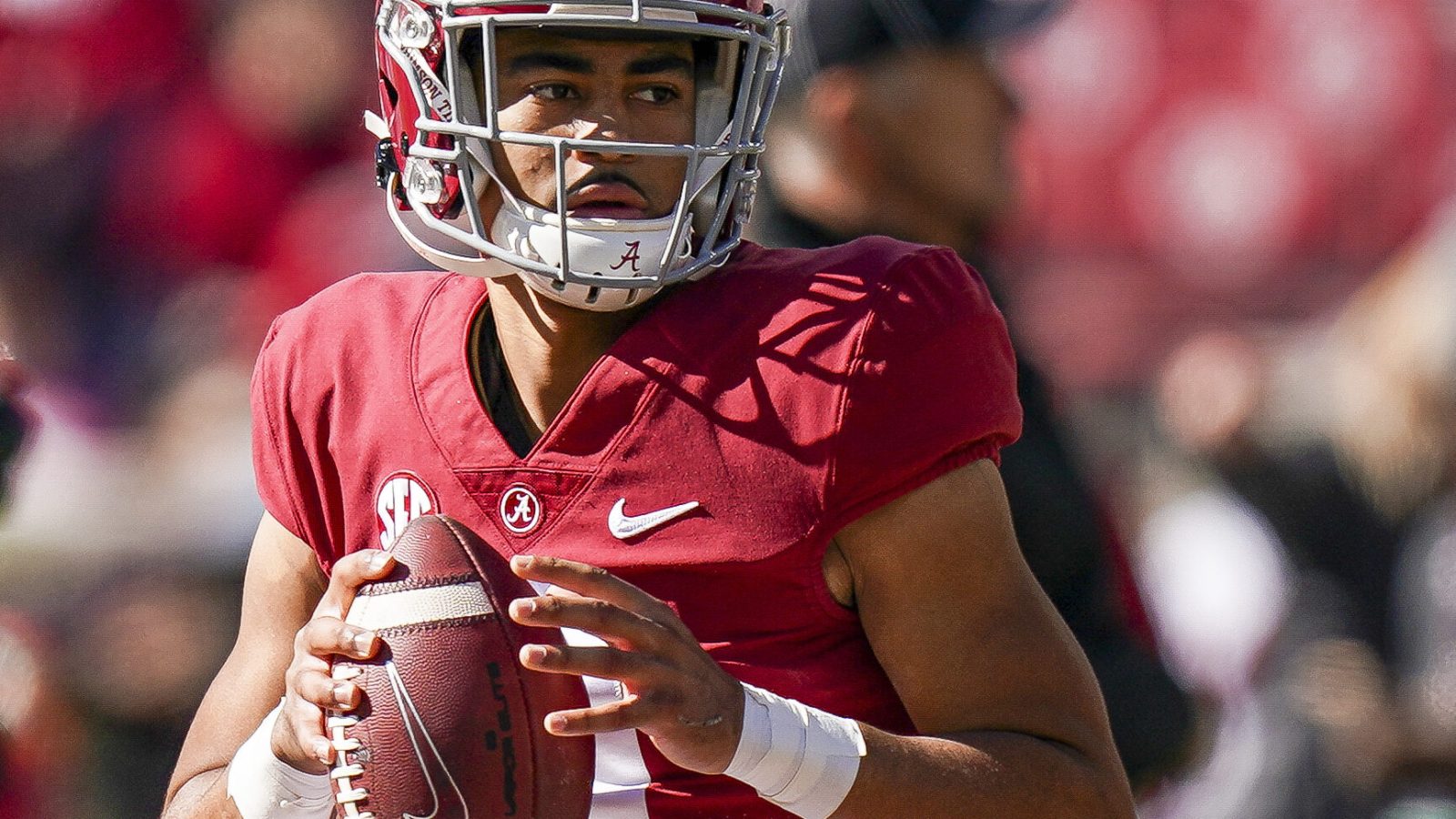 Alabama Crimson Tide quarterback Bryce Young looks downfield before throwing a pass in a game against New Mexico State