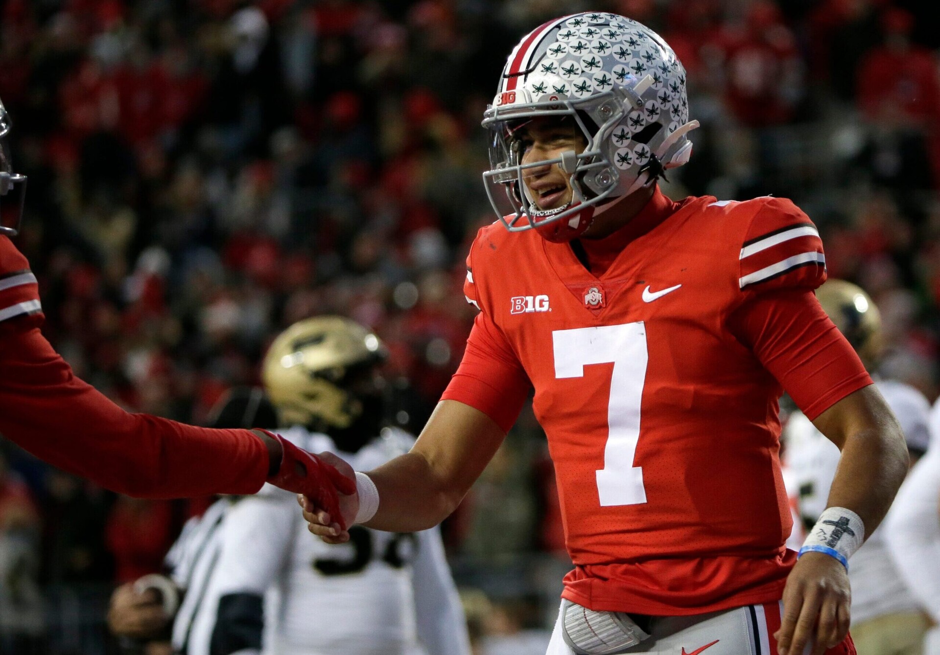 Ohio State Buckeyes quarterback C.J. Stroud celebrates with an unidentified teammate after scoring a touchdown in a game against Purdue