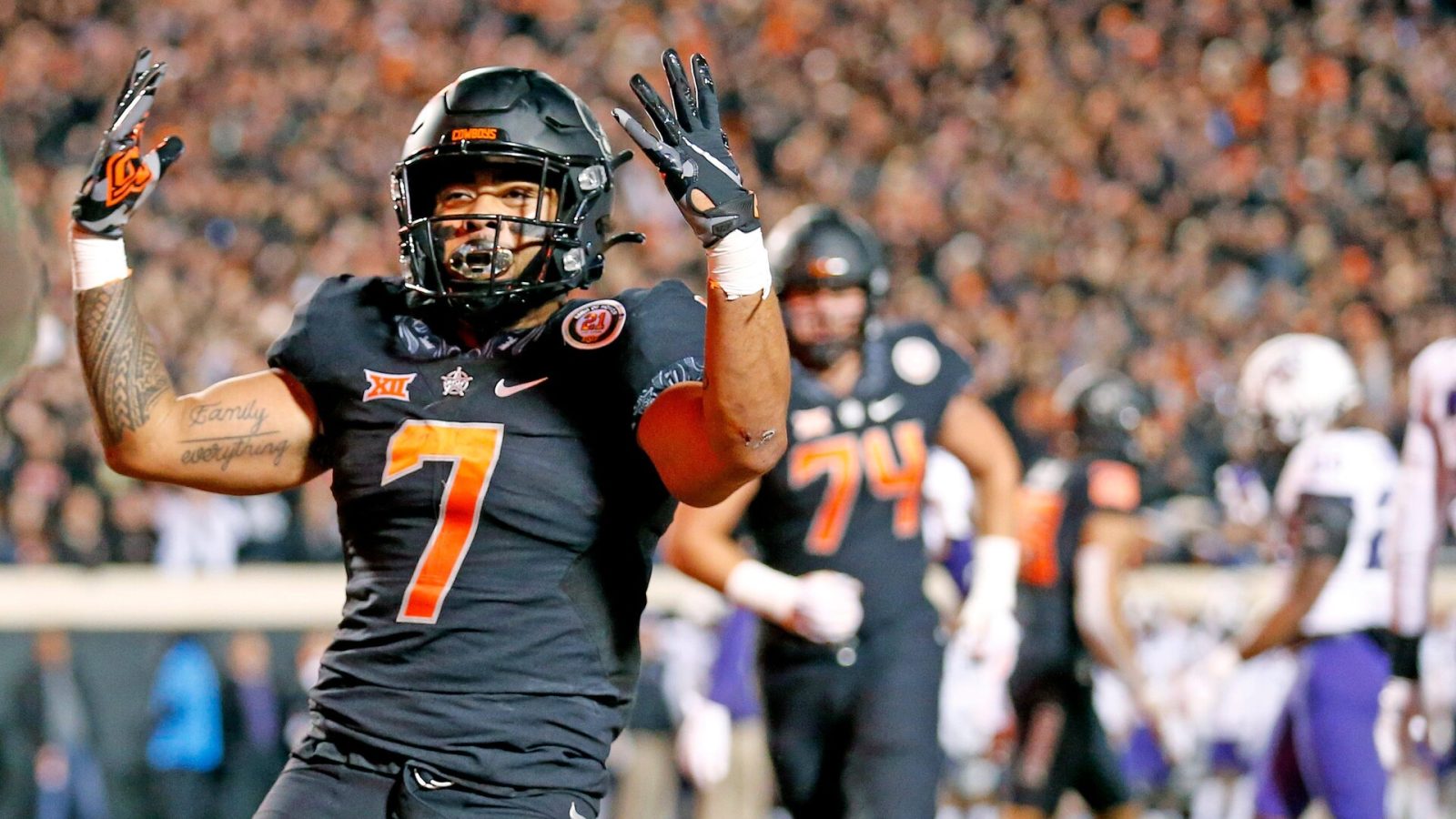 Oklahoma State's Jaylen Warren celebrates a touchdown against TCU