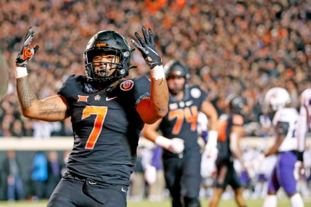 Oklahoma State's Jaylen Warren celebrates a touchdown against TCU