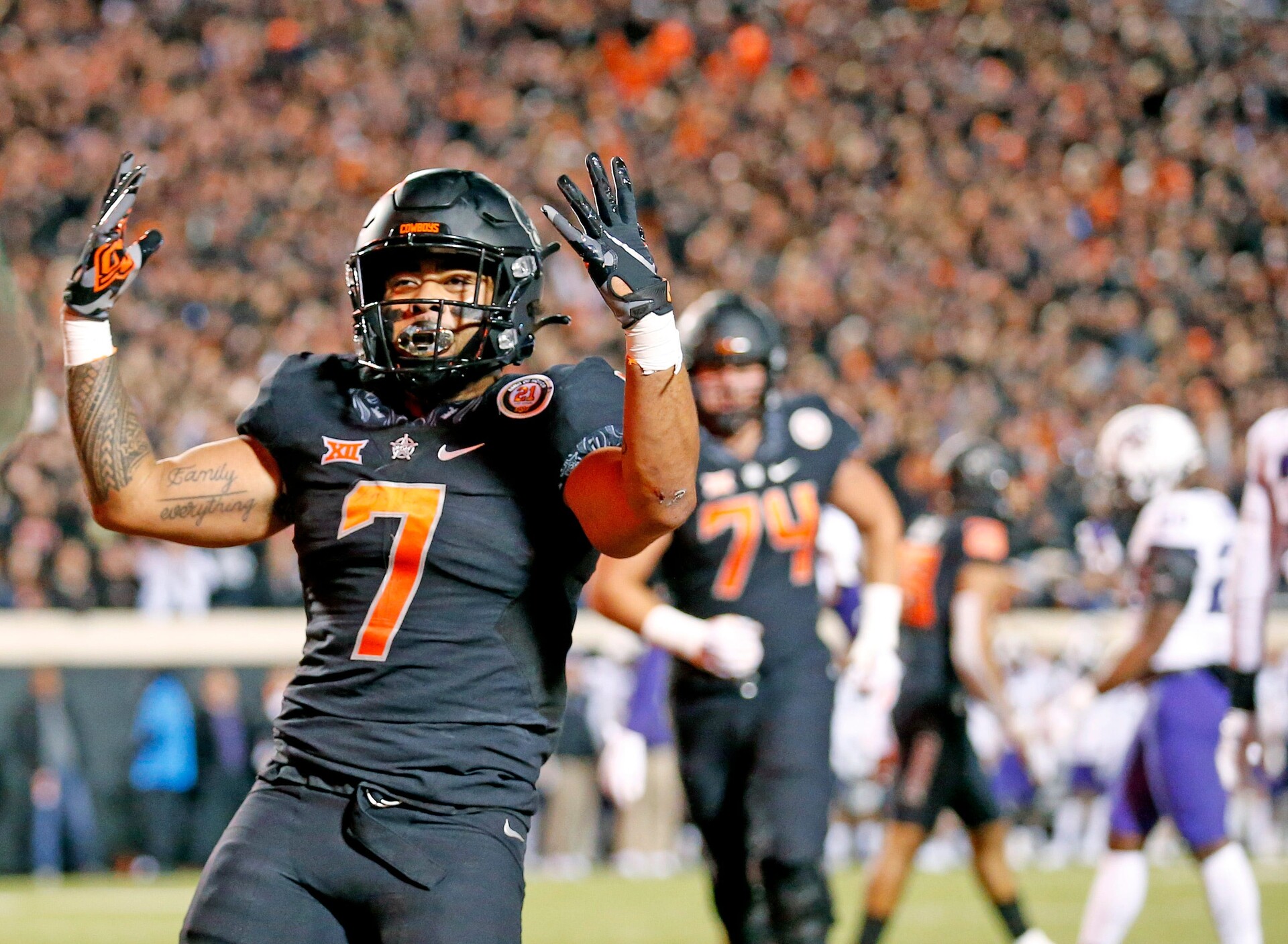 Oklahoma State's Jaylen Warren celebrates a touchdown against TCU