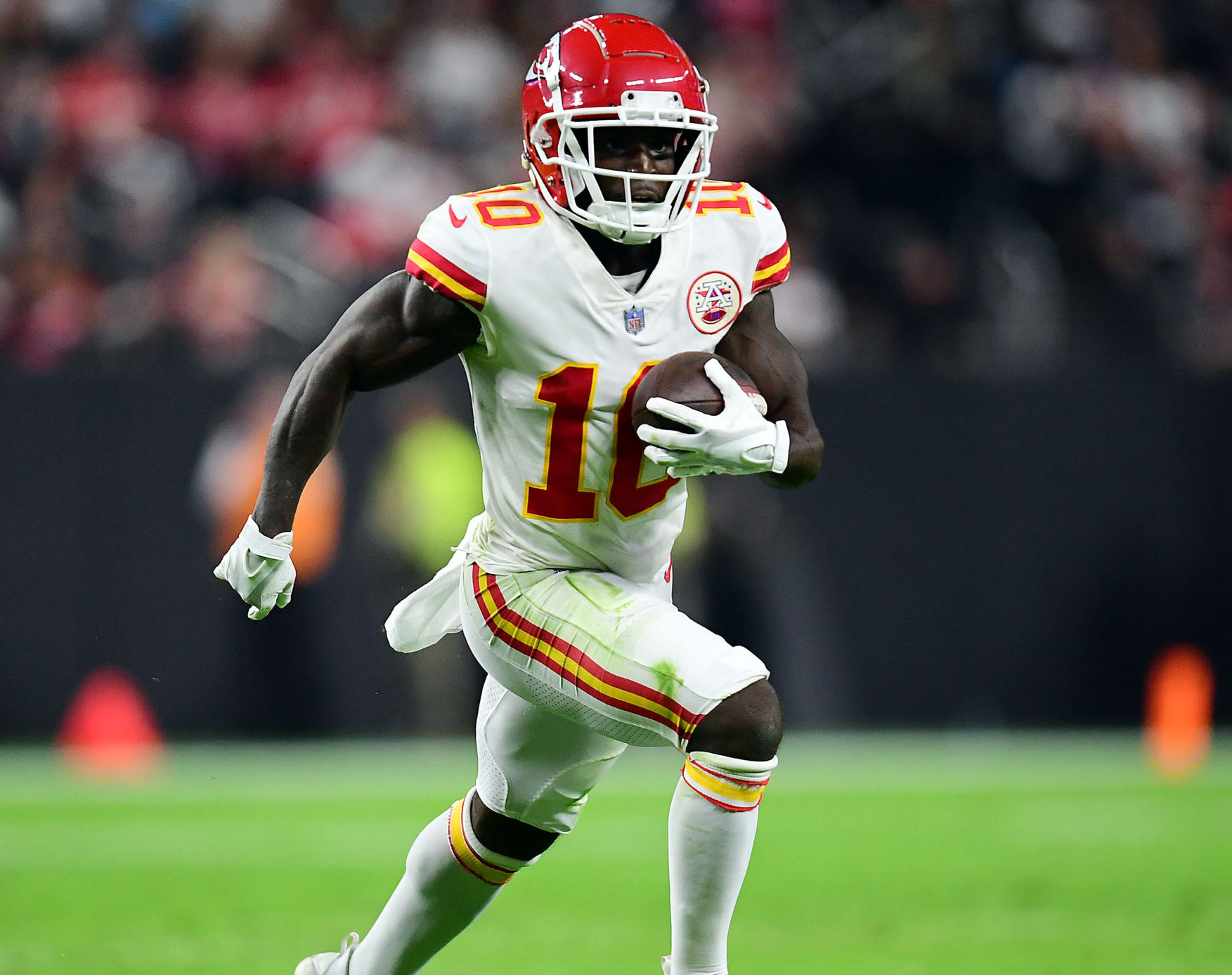 Kansas City Chiefs wide receiver Tyreek Hill runs the ball after making a catch against the Las Vegas Raiders