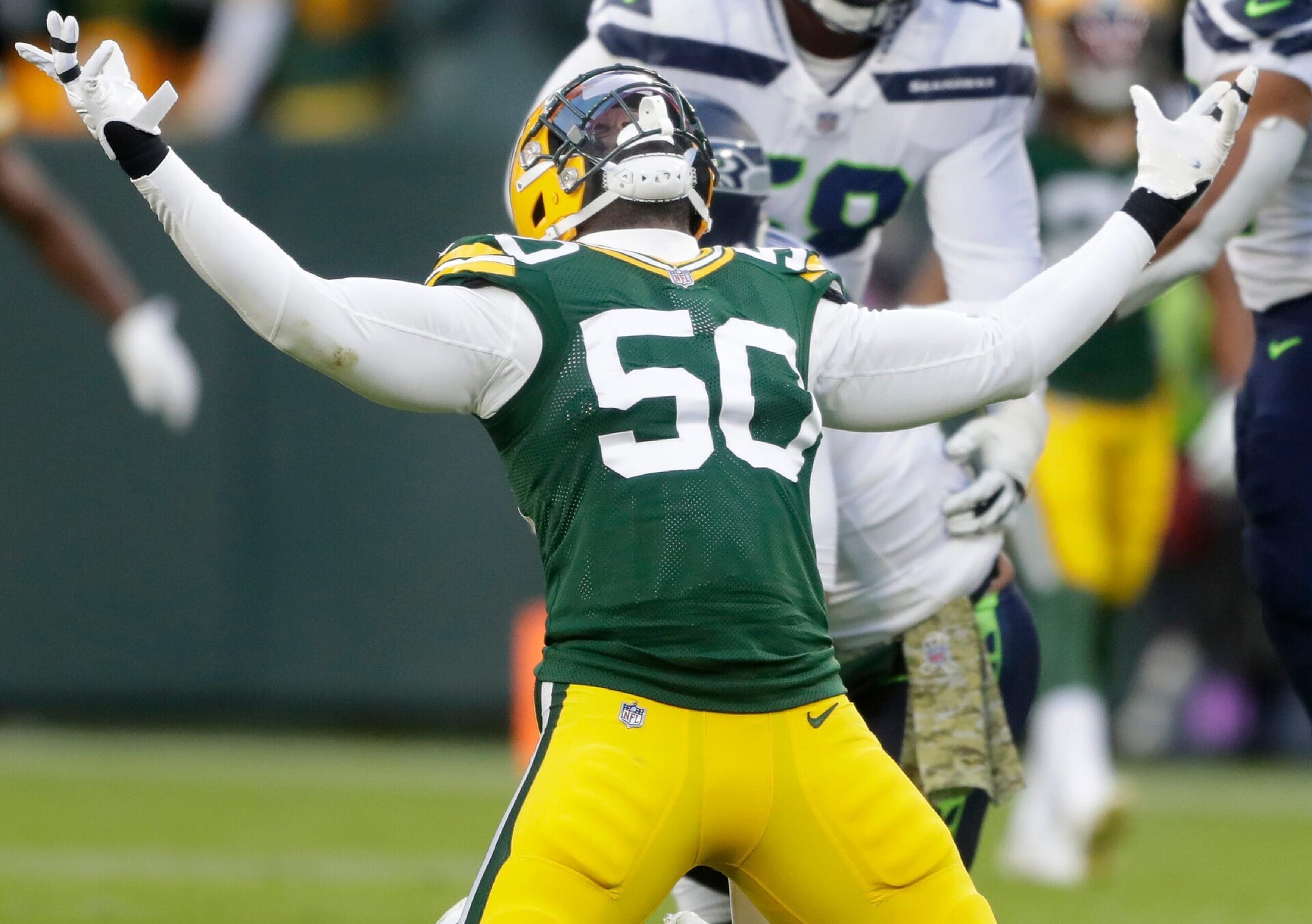 Green Bay Packers defensive end Whitney Mercilus reacts after sacking Seattle Seahawks quarterback Russell Wilson (not pictured)